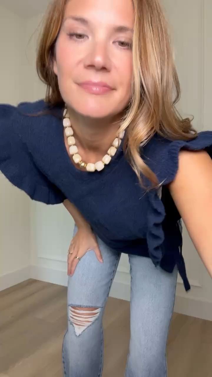 This navy ruffle top gives a simple jeans outfit so much more personality. I love the statement sleeves with light wash denim and brown shoes for a fall look that feels feminine without being too dressy.

Navy ruffle top, Fall tops, Tall girl fashion, Tall friendly clothing, Light wash jeans, Ruffle sleeve top, Jeans outfit, Fall outfit ideas, Feminine fall style, Casual fall outfit, Tall girl outfits, StangandCo

#LTKootd #LTKTall #LTKSeasonal