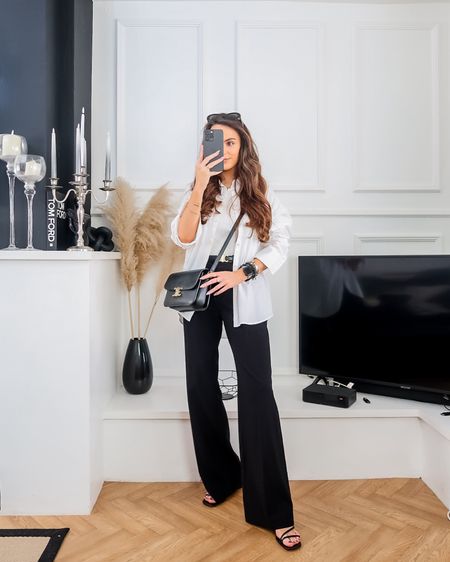 Spring outfit, spring fashion, transitional outfit idea, spring workwear look, monochrome outfit, black trousers, tailored trousers, white shirt styling, oxford shirt, ribbed vest top, black strappy heels 

#LTKeurope #LTKworkwear #LTKstyletip
