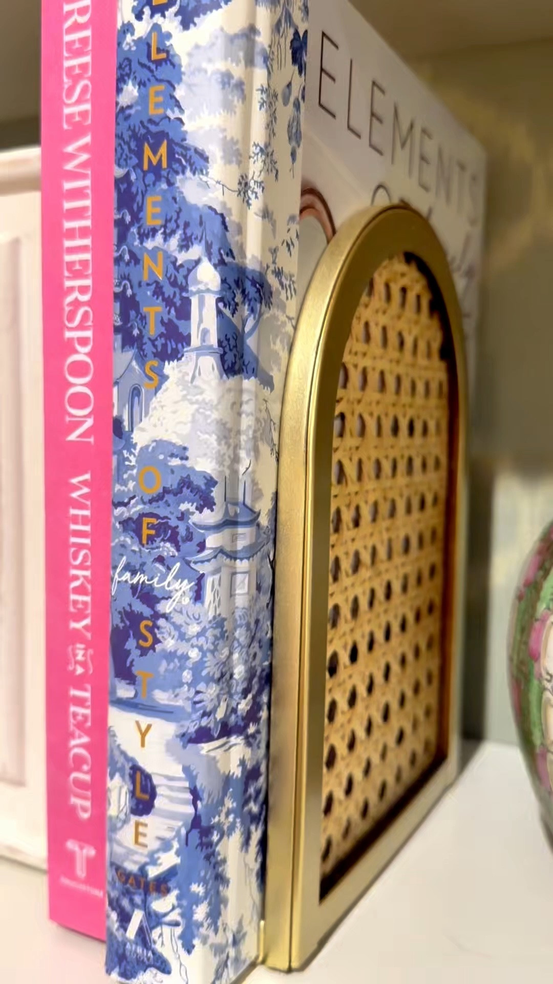 Patriotic Bookshelf Styling 🇺🇸 Grandmillennial Shelf Decor with Chinoiserie & Coffee Table Books

Adding a little patriotic charm to my bookshelf ❤️🤍💙 Styled this shelf with the prettiest gold + rattan bookends, colorful coffee table books, chinoiserie accents, and a sweet “Home of the Brave” print for a classic grandmillennial look ✨ I love mixing timeless Southern style with pops of pink, blue, and Americana decor for summer! These affordable rattan bookends are such a good find and make shelf styling feel instantly elevated 🏡🎀

Linked my bookshelf decor favorites including the gold rattan bookends, coffee table books, patriotic artwork, and chinoiserie-inspired accents ✨

bookshelf decor, grandmillennial decor, patriotic home decor, Americana decor, summer home styling, coffee table books, shelf styling ideas, chinoiserie decor, pink and green decor, Southern home decor, preppy home decor, woven rattan decor, gold home accents, coastal grandmother decor, classic home styling 🇺🇸🩷💙

#LTKHome #LTKSeasonal #LTKmomlife