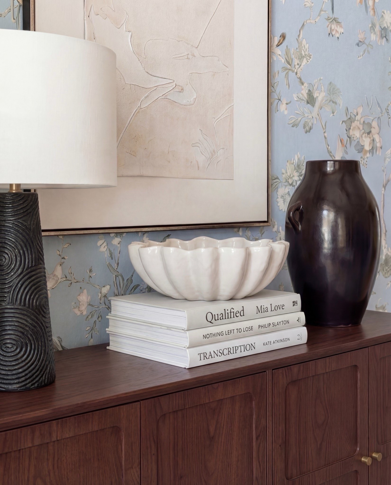 Shop the Look:
• Solid wood dining table
• Upholstered dining chairs with brass frames
• Blue floral wallpaper
• Blue patterned traditional rug
• Wood ceiling beams
• Glass candle holders
• Black ceramic bowl decor
Black ceramic vase
Brass serving tray
Solid wood buffet console
Solid oak tall cabinet
Black ceramic decor bowl
White decor books
Black table lamp, white fluted decor bowl
• Neutral linen curtains
• Wood display cabinet with glass doors


#LTKHome #LTKSaleAlert