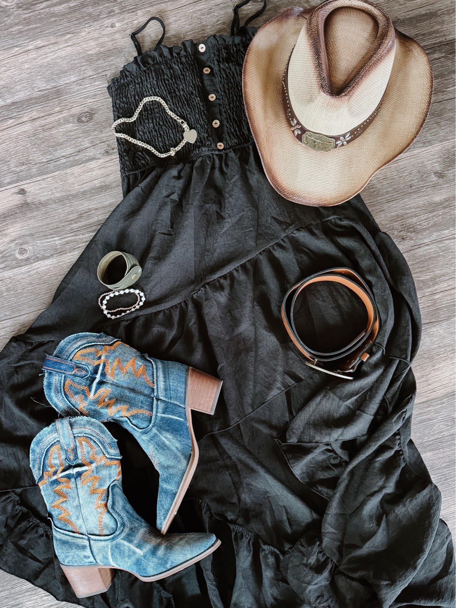Country concert inspo ✔️ Loving this black asymmetrical dress with these denim boots, cowboy hat and brown belt. Wearing a small in the dress.

As an Amazon Influencer I earn commission on qualifying purchases.

Black strappy dress, summer concert inspo, festival outfit idea, summer fashion 2026, spring style, cowgirl hat, denim cowboy boots, chunky gold necklace

#LTKootd #LTKOver40 #LTKMidsize