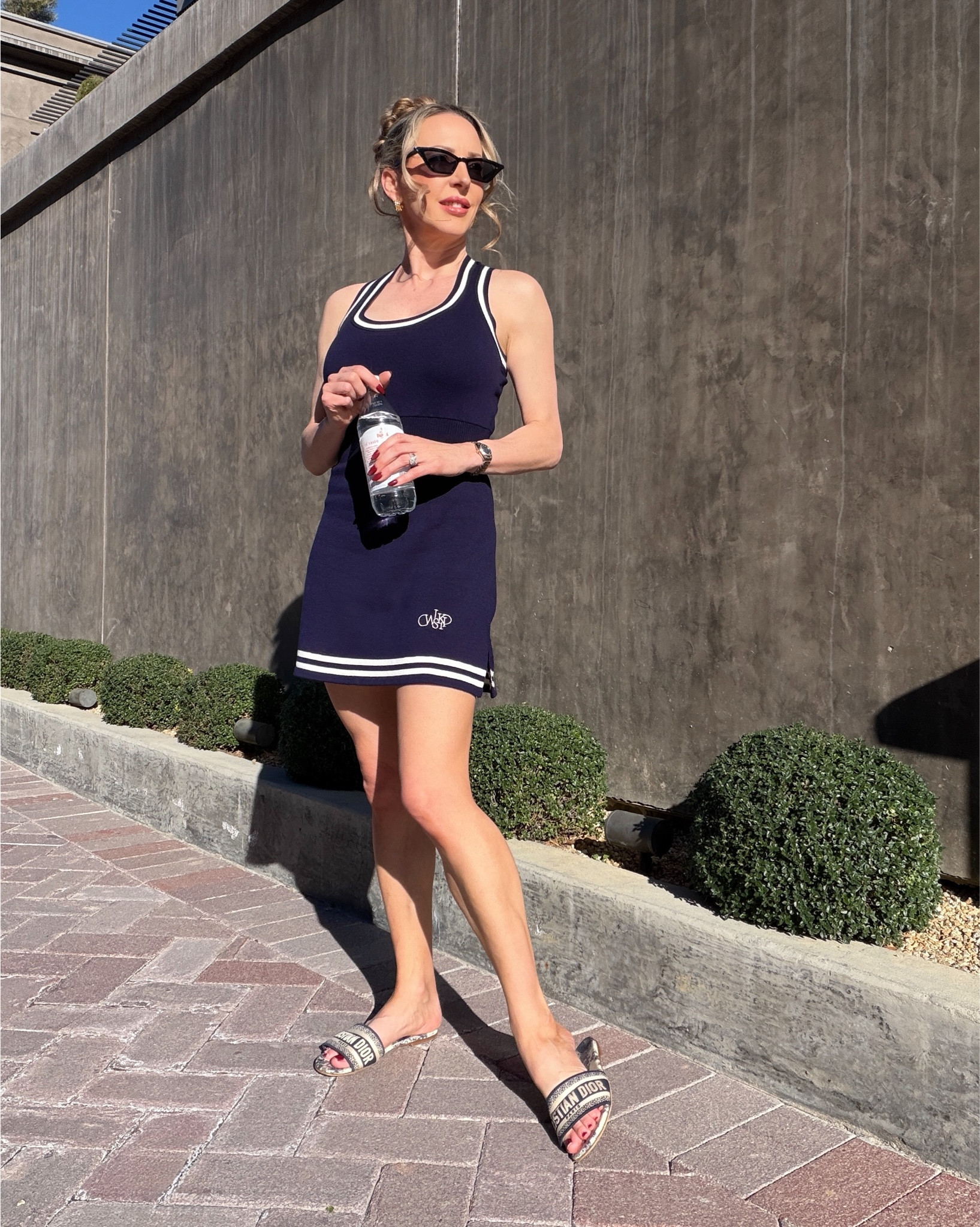 The cutest sporty but chic everyday outfit: WISKII Active navy tennis dress with built in shorts, non slip strap sports bra, there’s also a matching cropped cardigan, and navy Dior slide sandals. Perfect for playing pickleball, tennis (change to sneakers), running errands, lunch, sightseeing and everything life!

#LTKootd #LTKActive #LTKPetite