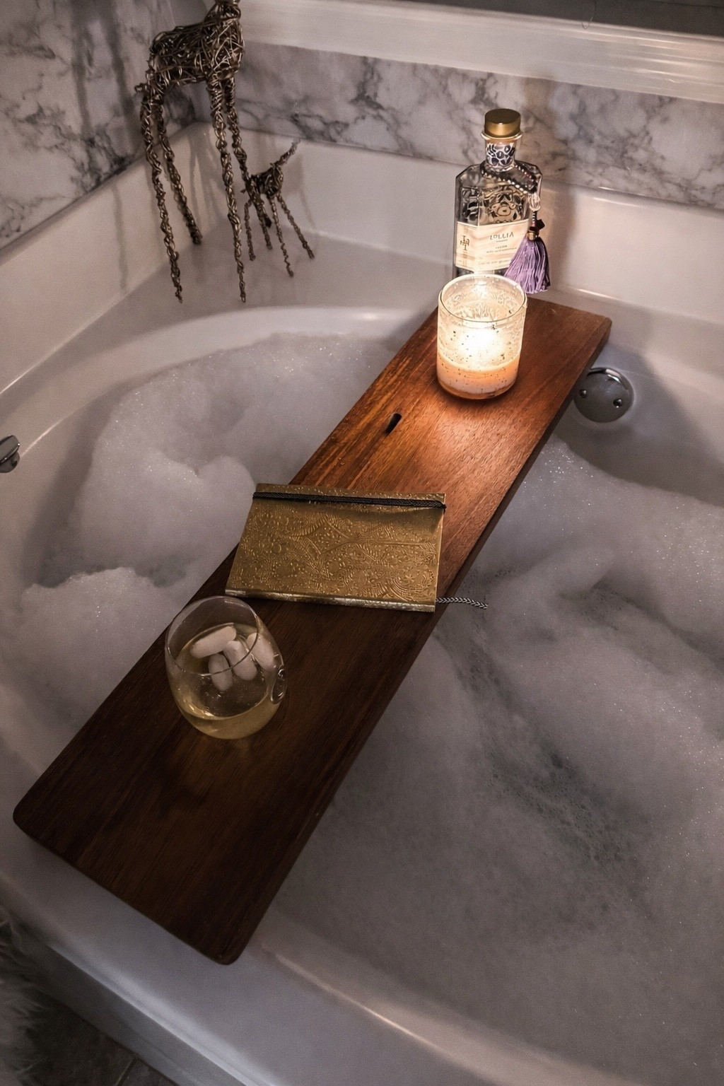 Turning my bathroom into a spa ✨🛁
Nothing beats a slow evening soak with all the cozy essentials — a wooden bath tray, calming candlelight, a glass of something chilled, and the prettiest little details to set the mood.

Sharing all my favorite bath-time must-haves that make unwinding feel extra luxe 💆‍♀️💫

Amie Pagan, bath essentials, Lilia bubble bath, bath accessory tray, at home spa 

#LTKselfcare #LTKHome #LTKBeauty