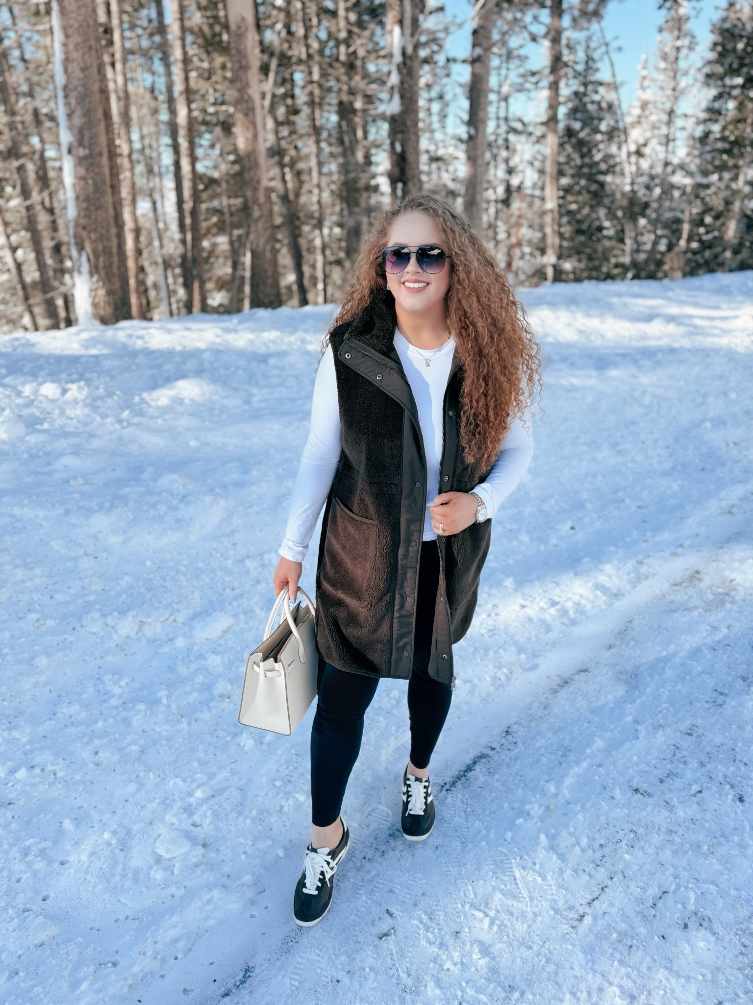 Layered, cozy, and ready for all the winter adventures ❄️✨ This vibe is everything right now!🤎 brown midi vest | Nordstrom vest outfit | white fitted long sleeve | Amazon long sleeve | black leggings | Amazon leggings | brown sneakers | Walmart sneakers | Amazon aviators | winter outfit | cozy winter outfit | casual winter look | snow day outfit | winter layering | weekend winter outfit | Amazon fashion | winter athleisure | snow photoshoot outfit | casual winter outfit | winter street style | layered winter outfit | cozy layering outfit | brown vest outfit | Amazon winter style | winter chic outfit | knee-length vest outfit | snow day style | winter weekend look | brown sneakers outfit

#LTKMidsize #LTKgrwm #LTKootd