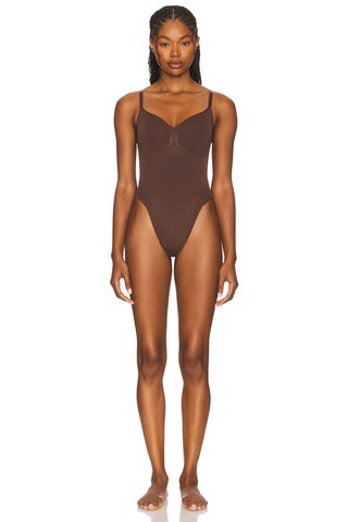 SKIMS Seamless Sculpt Thong Bodysuit in Brown | FWRD 