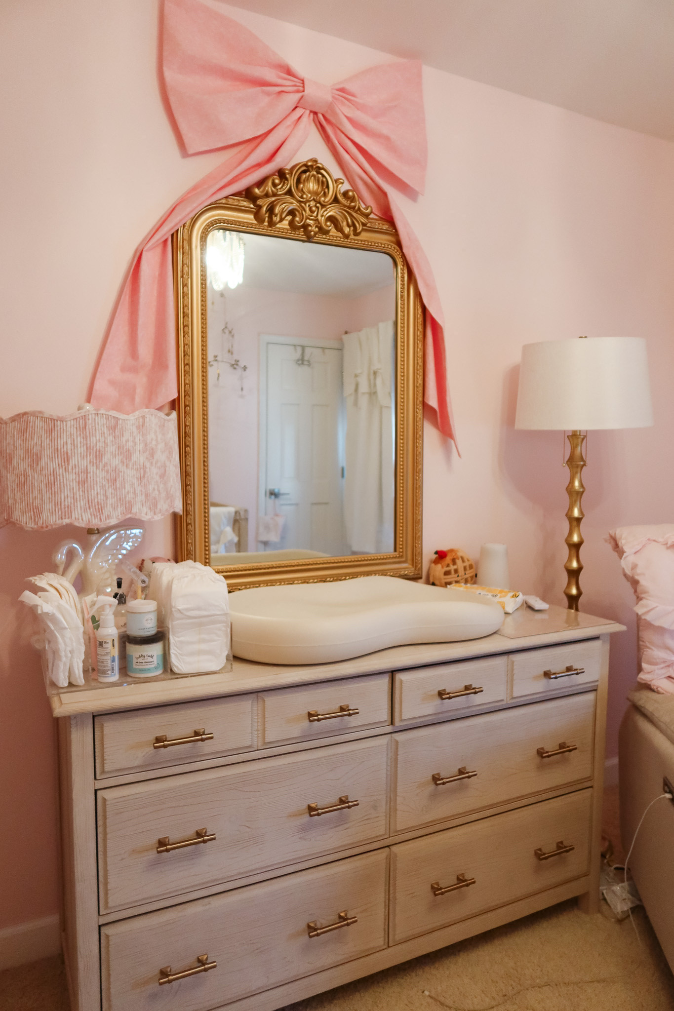 Our diaper changing station + dresser setup 🤍✨ Practical, organized, and still fits the nursery aesthetic.

I love using a dresser as a changing table — so much extra storage for diapers, wipes, creams, sleepers, swaddles, and backup outfits (because we all know we need them 😅). Baskets + drawer dividers make everything easy to grab during those middle-of-the-night changes.

Everything is linked in my LTK 💕

nursery dresser setup / diaper changing station / baby room organization / dresser as changing table / diaper station essentials / nursery storage ideas / baby girl nursery decor / newborn must haves / changing table organization / functional nursery finds

#LTKmomlife #LTKBaby