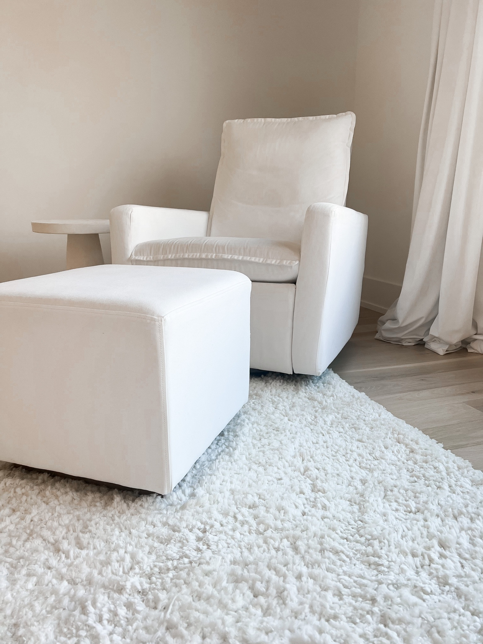 Nursery rug and chair. Highly recommend the chair. So comfortable and high back. Only regret is not getting the automatic recline because it’s hard to put a foot rest down with a sleeping baby in your arms but it’s fine and mostly prefer rocking anyway 😆 I will say after about 2 days the rug had a strong chemical-like odor so currently airing it out and will report back. If it persists, I may return  

#LTKhome #LTKbaby #LTKkids