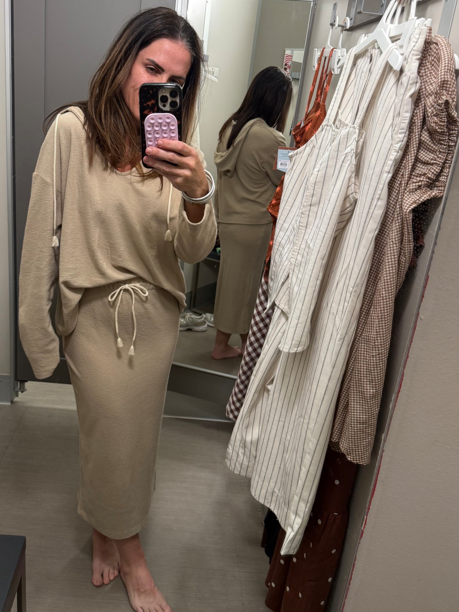 Incredibly comfortable and perfectly slouchy hooded pullover with roping detail. I did TTS on top. This skirt here is a size smaller than my normal. I ordered tts. 

#LTKSaleAlert #LTKOver40 #LTKmomlife