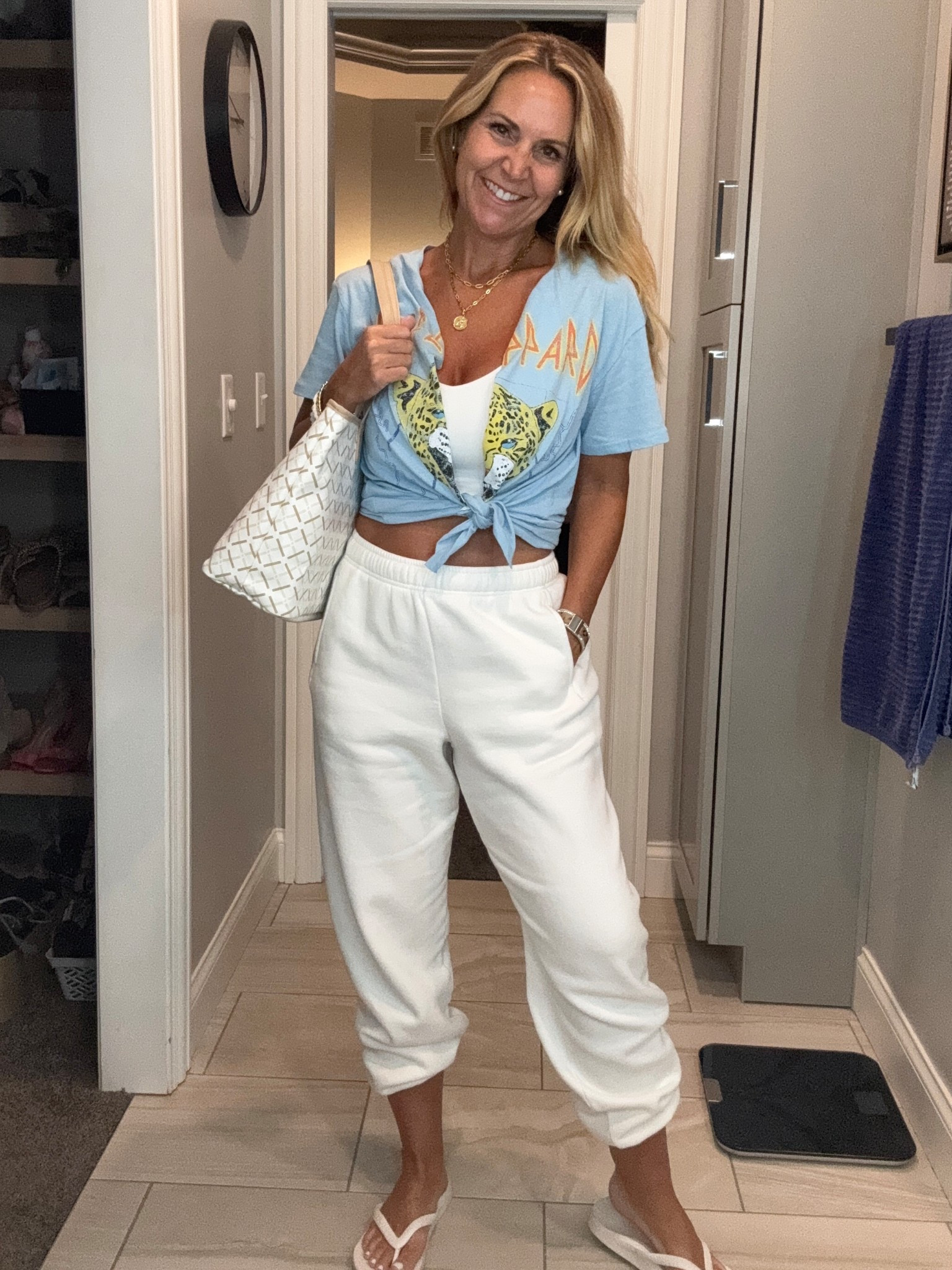 Def Leppard T - cut down the middle for fun and tied it. Wore it over this Aerie tank with the softest sweats ever!
Perfect travel or lounging outfit.
Size medium sweats for oversized look. Medium bra top and t-shirt too!
-
-
Travel looks, comfortable style, mom style, graphic t’s

#LTKOver40 #LTKSaleAlert #LTKStyleTip