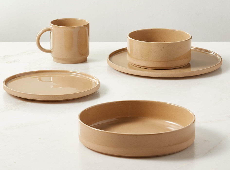 Darra 4-Piece Natural Recycled Stoneware Dinnerware Set With Soup Bowl

Sand-colored recycled stoneware sets a refined yet relaxed table in a natural palette. Crafted in Portugal, the stackable dinnerware set is made of Ecogres®, a proprietary clay composed of 90% recycled materials. Unglazed on the exterior for a naturally tactile finish, the interior features a high-gloss glaze that highlights subtle black flecks in the clay. Set includes a dinner plate, salad plate, soup bowl and mug. CB2 exclusive

#LTKStyleTip #LTKHome #LTKParties
