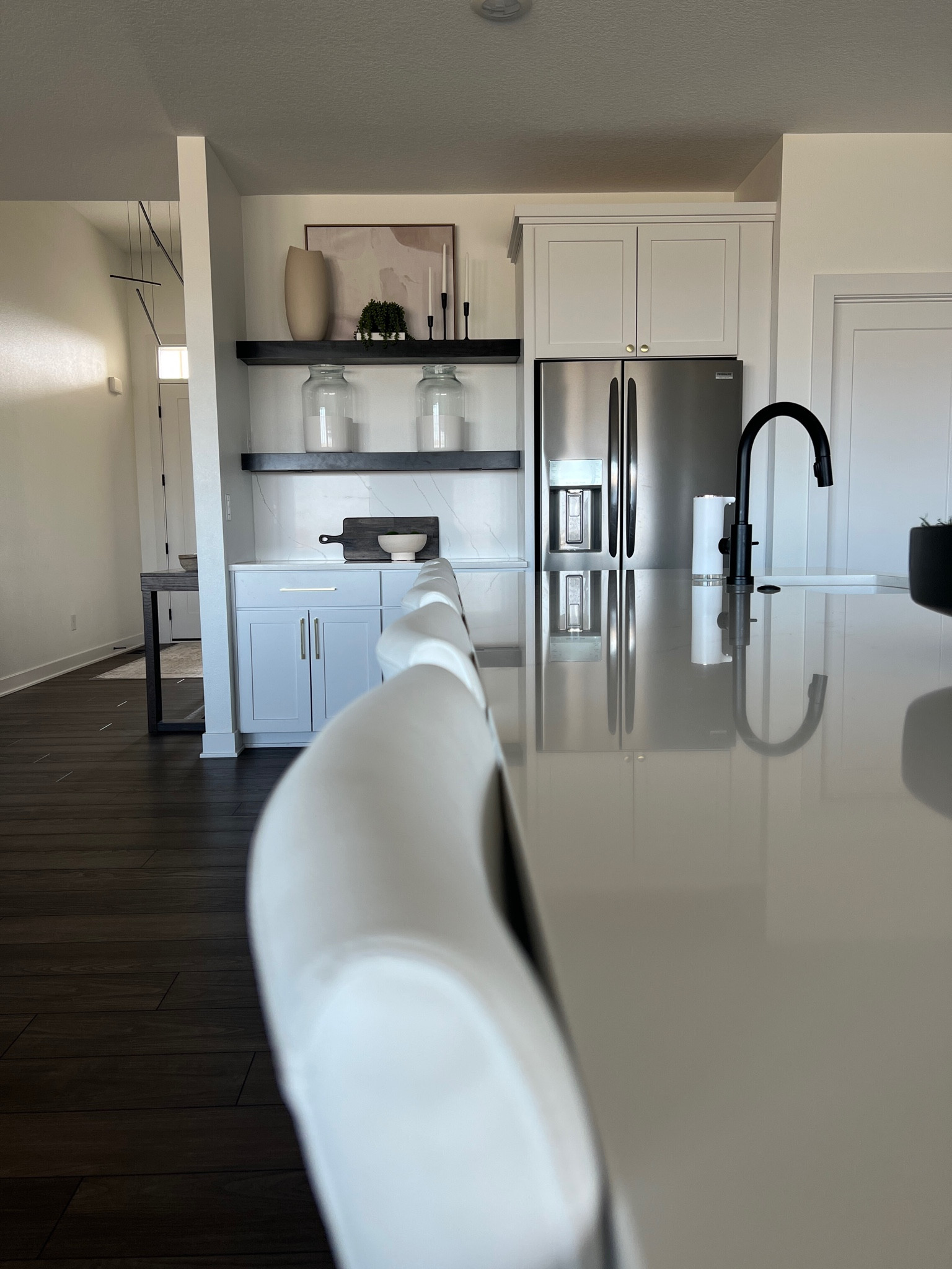 One of my favorite things about my kitchen is our large island and these white leather chairs from Amazon . I also love switching up the floating shelves styling.

#LTKhome