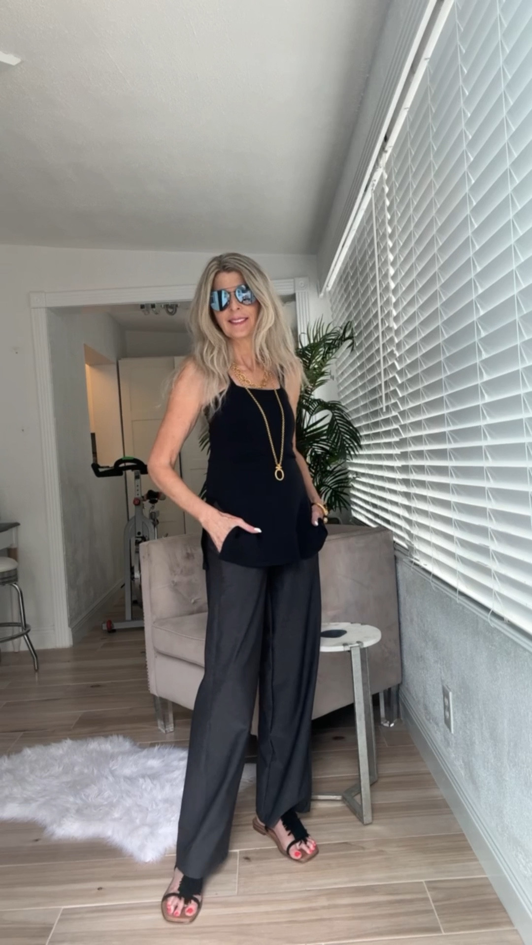 Comfy & versatile outfit from #KiraGrace - Side Slit Cami top & Traveler Pants (with pockets of course 😉). Looks great now with sandals & easily transitions into Fall with boots & a jacket. Ideal for work wear, travel outfit, or an evening out. I feel like these are definitely closet staples with tons of styling options! Comfort of yoga pants with an elevated style! Charcoal grey pants, Black top, gold jewelry, travel  outfit, work outfit, casual to dressy. 

#LTKStyleTip #LTKWorkwear #LTKTravel