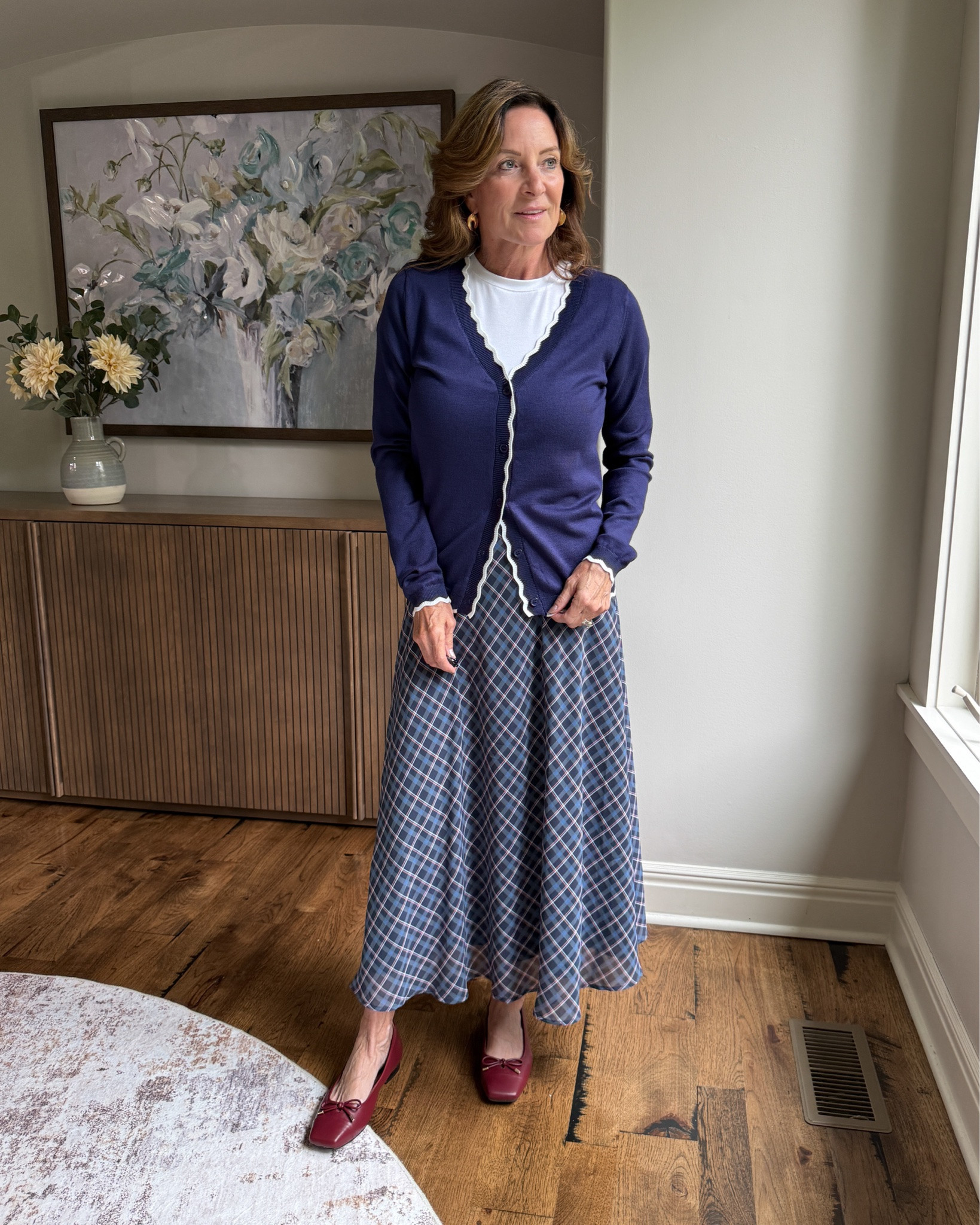 Plaid for Fall, Without Going Preppy

A flowing plaid midi skirt paired with a navy cardigan and simple white tee feels classic but still current. Burgundy flats add just enough fall color to finish the look.

#fallstyle #over50style #plaidstyle #midiskirt #outfitideas

Commissioned Link