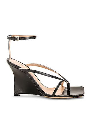 Bottega Veneta Stretch Ankle Strap Wedge Sandal in Black - Black. Size 36.5 (also in 35, 35.5, 37.5, 38, 38.5, 41, 42). | FWRD 