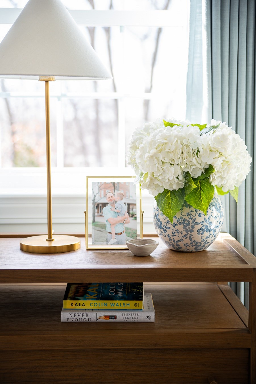 The prettiest blue floral vase paired with my favorite faux hydrangeas gives the perfect coastal look on my nightstand! Shop them here!

#LTKHome