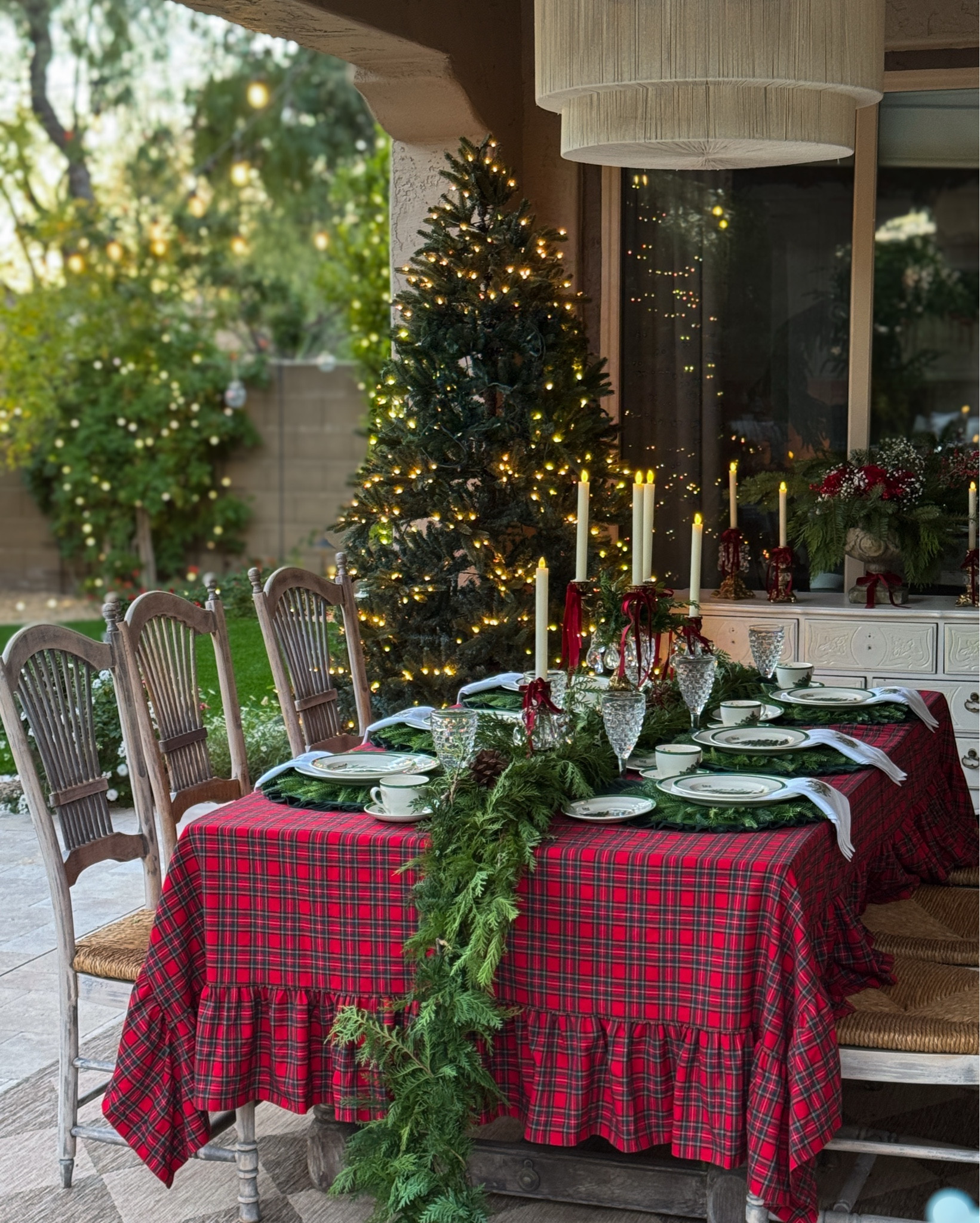 Christmas Alfresco tablescape 

Fresh greens are from Trader Joe’s 

Plaid tablecloth, tartan tablecloth, tartan ruffled tablecloth, fresh evergreens. Fresh evergreen garland, ruffle tablecloth 

#LTKSeasonal #LTKHoliday #LTKHome