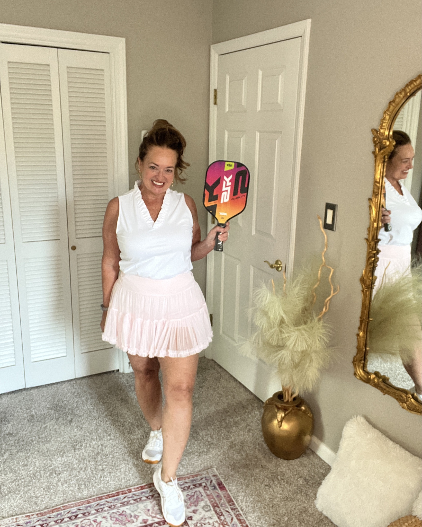 Sheer ruffle sport skirt! Beautiful and feminine. The ruffles v neck tank matches perfectly. Pickel ball , golf, tennis.?

#LTKfitnessgoals #LTKFestival #LTKActive