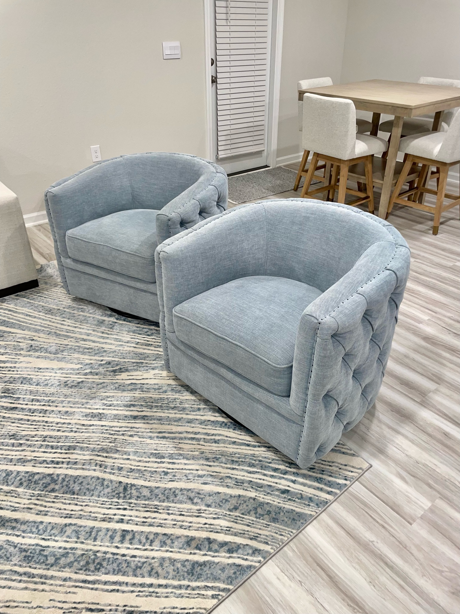 Living room swivel chairs are on sale!! 

blue tufted costal light ivory tan rug beach homegood furniture decor clearance 

#LTKhome