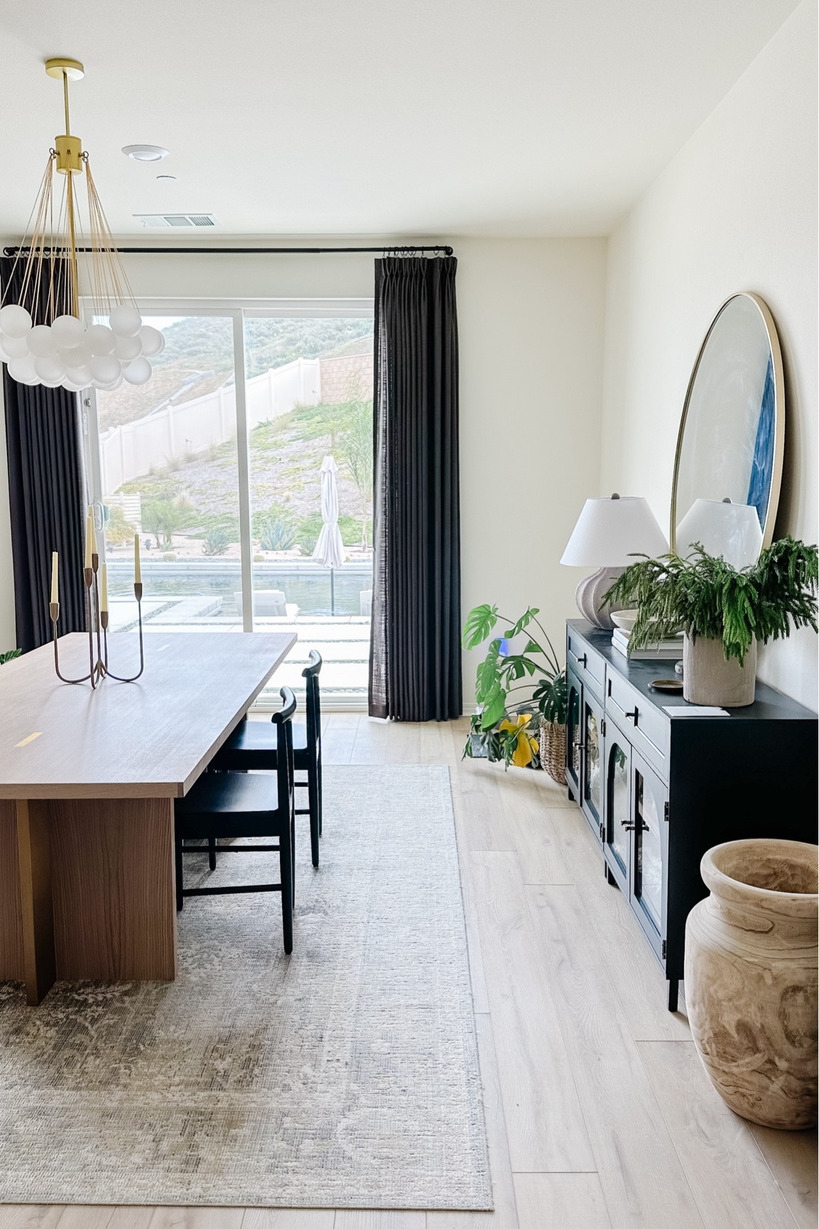 Neutral dining room. Bubble light fixture 

#LTKHome