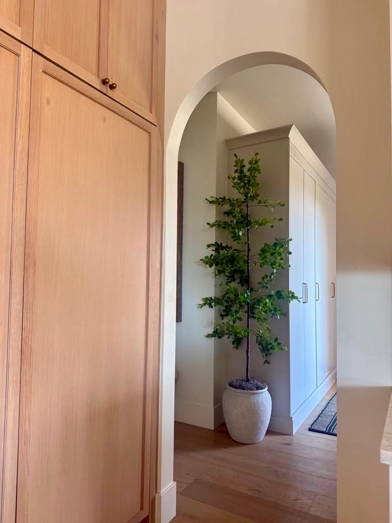 I’m linking the faux tree and planter that instantly fill an empty corner and make the whole space feel more finished. The natural shape, soft greenery, and textured pot add warmth without overwhelming the room.

I love using a tall statement tree in transitional spaces like hallways and archways because it brings height, texture, and a custom designer look. Shop the exact pieces I used, along with a few similar favorites.
@lowes 
@Wayfair

#LTKU #LTKHome #LTKSaleAlert