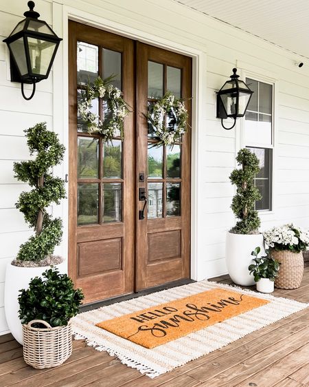 Front porch and front door home decor, modern farmhouse, style, classic white traditional transitional, layered jute, scatter rug and doormat outdoor decor, home accents and accessories. Large white planter spiral topiary boxwood tree outdoor table, faux artificial florals, geraniums, hydrangeas  plants and trees, outdoor wall Sconce lantern, lighting, light fixtures, spring, and summer wreaths.

#LTKhome #LTKFind #LTKSeasonal