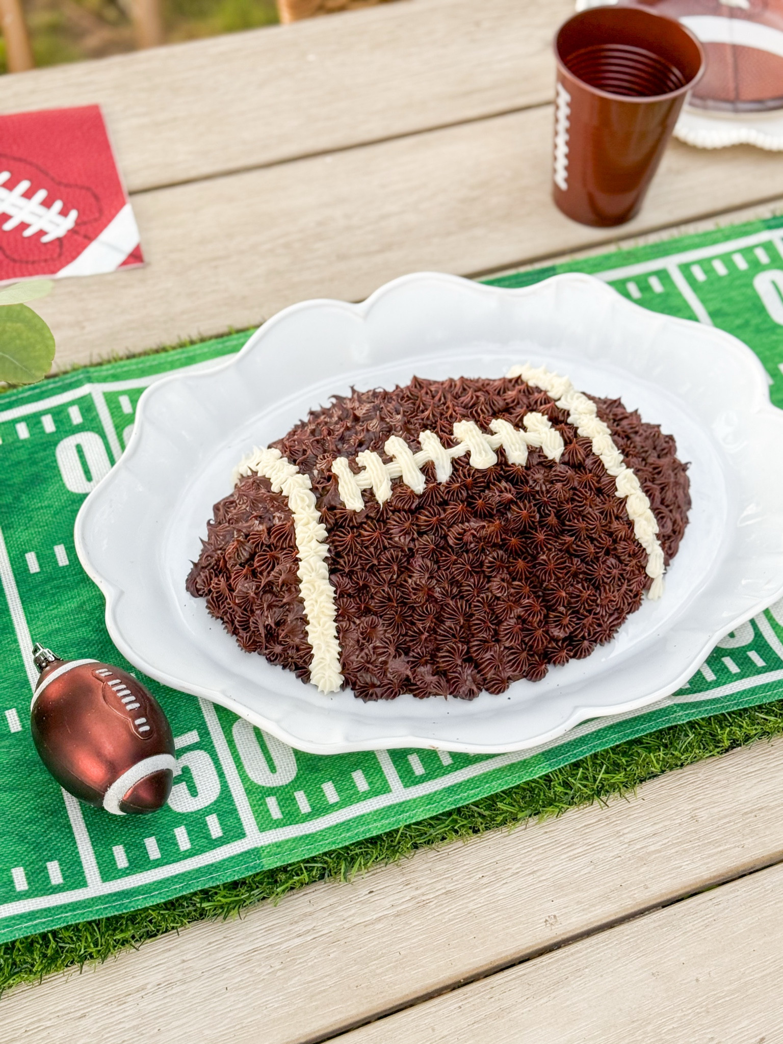 Super Bowl finds. Football shaped cake pan. Super Bowl Tablescape. Super Bowl table decor. White platter. Super Bowl table runner. Touchdown table runner. Football table runner. Football napkins. 🏈❤️ 

#LTKParties #LTKHome #LTKSeasonal