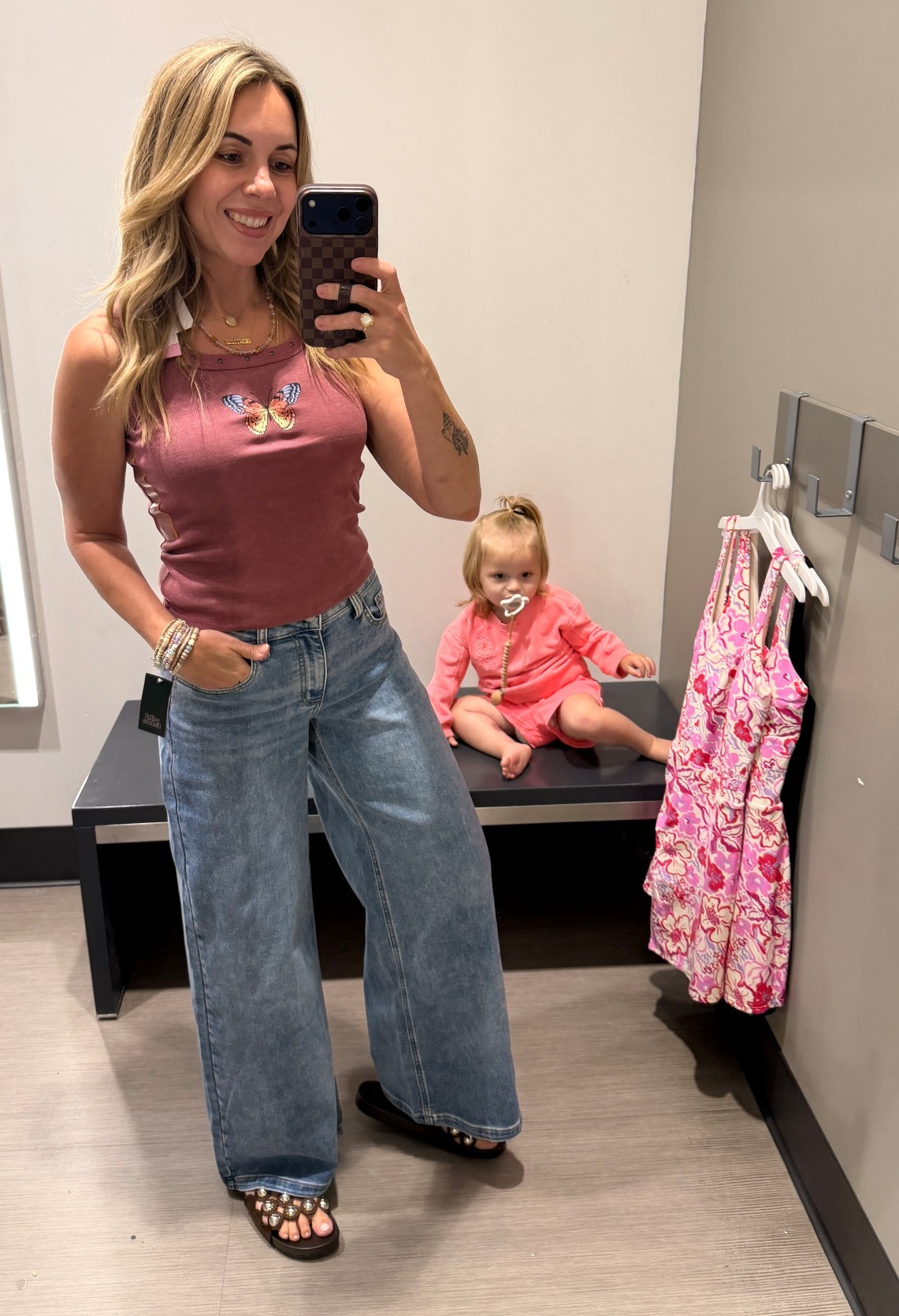 This was my true size small in the butterfly tank top and I had to have it! I sized up in the jeans to a 6 because they were a midrise and fit a little snug in the waist. I wanted them a little more baggy and the size up worked well. They have stretch and I’m 5’7, 135lbs, size 4.