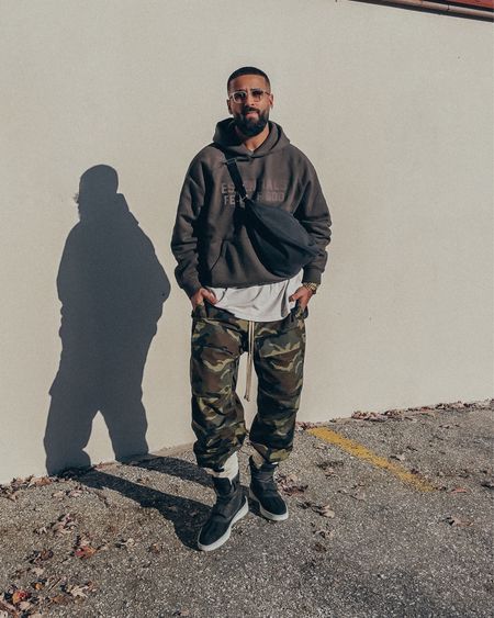 ESSENTIALS hoodie in ‘Off Black’ (size M). FEAR OF GOD tee in ‘Vintage White’ (size M), Army Cargos (size S), and Duck Boots (size 41). FEAR OF GOD x BARTON PERREIRA glasses in ‘Matte Taupe’. THE ROW Slouchy Banana Bag in ‘Black’. A casual men’s look that’s relaxed and elevated. Some pieces from this look are currently on sale, and make for great men’s holiday gifts. 

#LTKstyletip #LTKsalealert #LTKmens