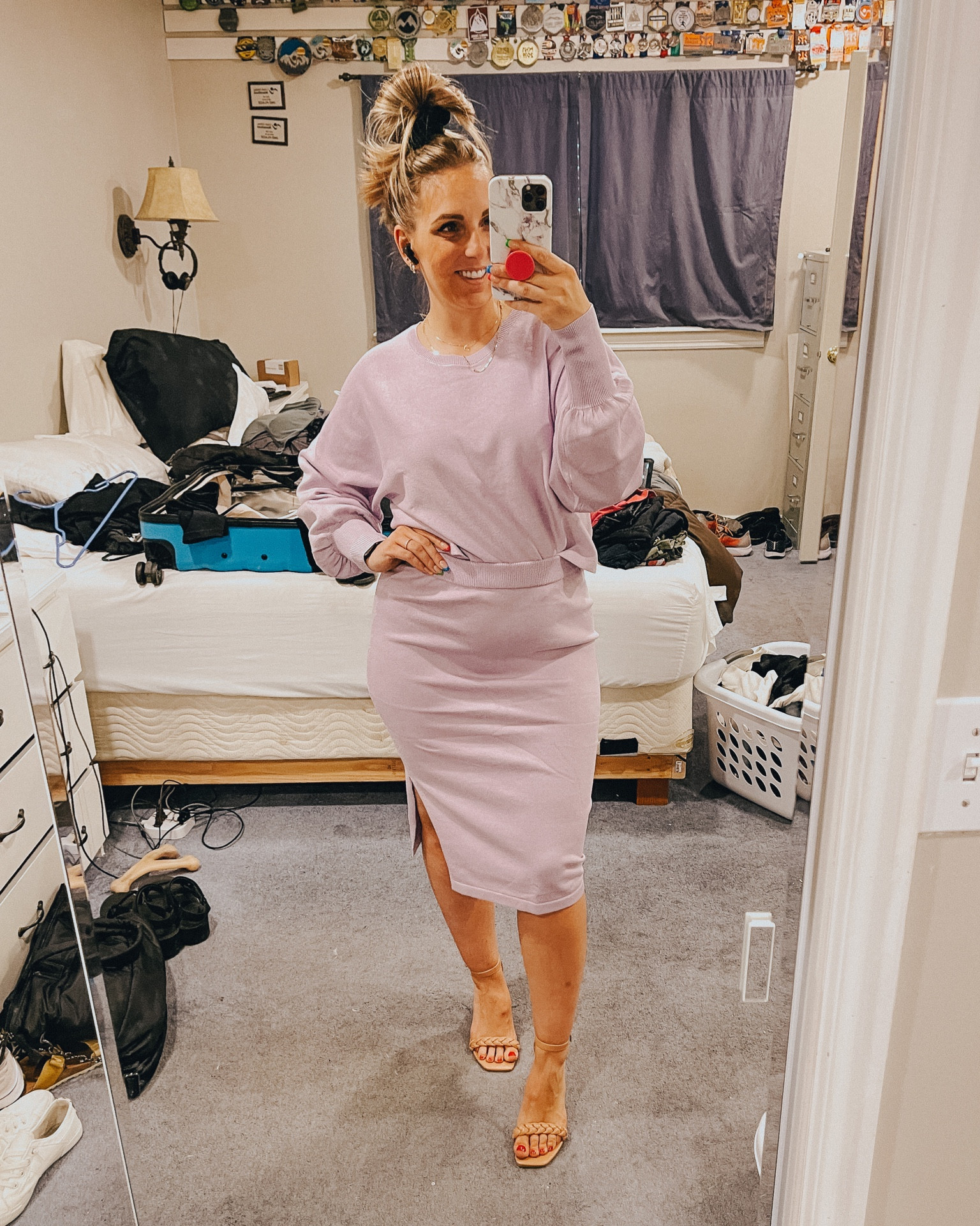 Runs somewhat small, I’m wearing a large but could wear a medium for a more fitted look  