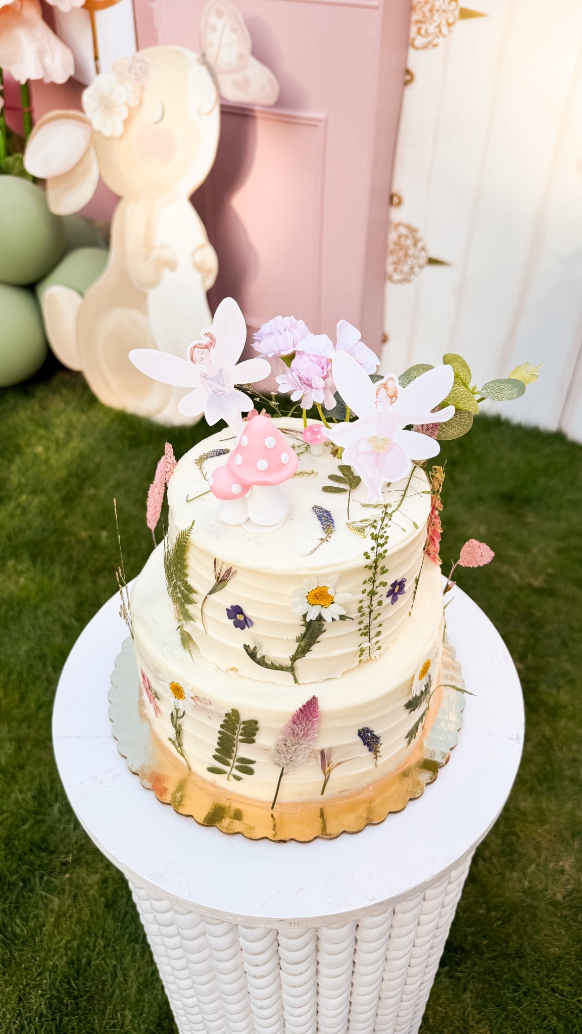 Fairy birthday cake made with Whole Foods Chantilly cake, dried flowers, and fairy cake topper kit!

#LTKParties #LTKHome #LTKKids