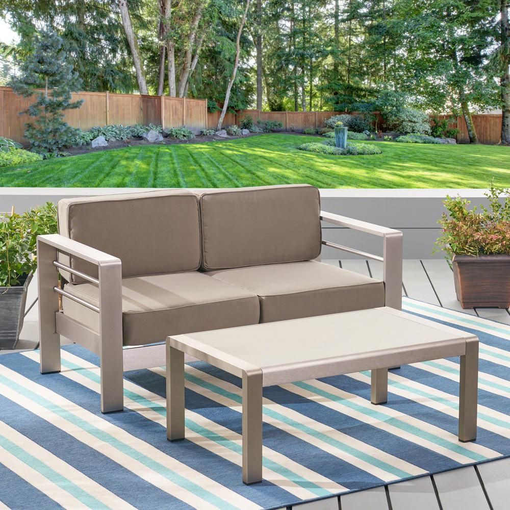 Noble House Cape Coral Silver 2-Piece Aluminum Patio Conversation Set with Khaki Cushions | The Home Depot