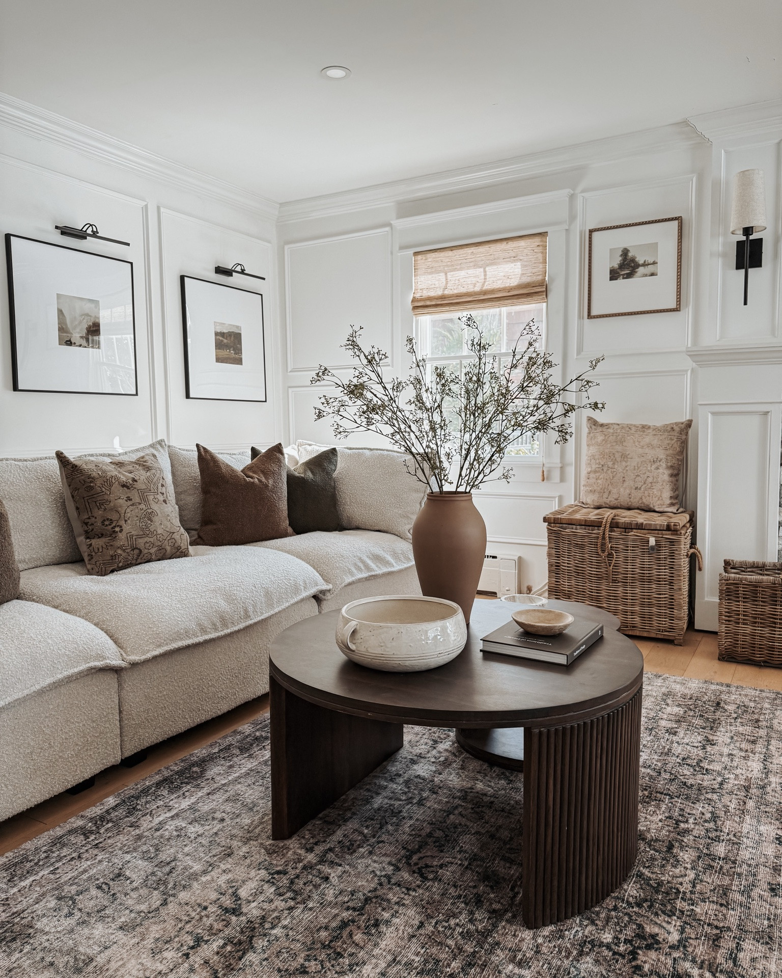 Living room boucle sofa, area rug, nesting coffee tables, wall decor, textured pillows, artificial branches, window shades, table decor, vase.

#LTKHome #LTKActive #LTKvlog