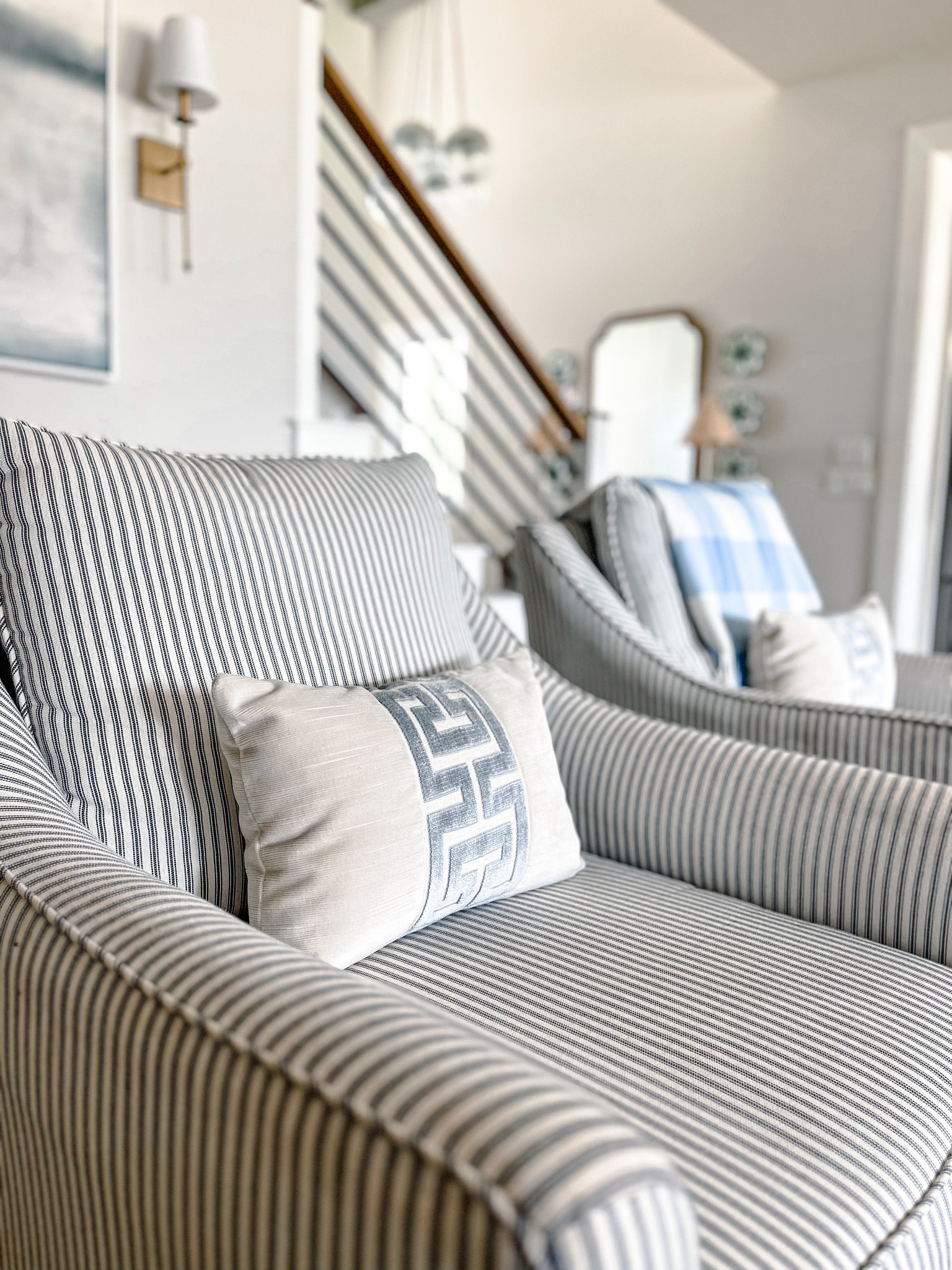 Gave these living room swivel armchairs a summer refresh by bringing in the lumbar pillows and a throw. A cozy light weight exchange for a summer refresh. 

#LTKhome #LTKfamily #LTKstyletip