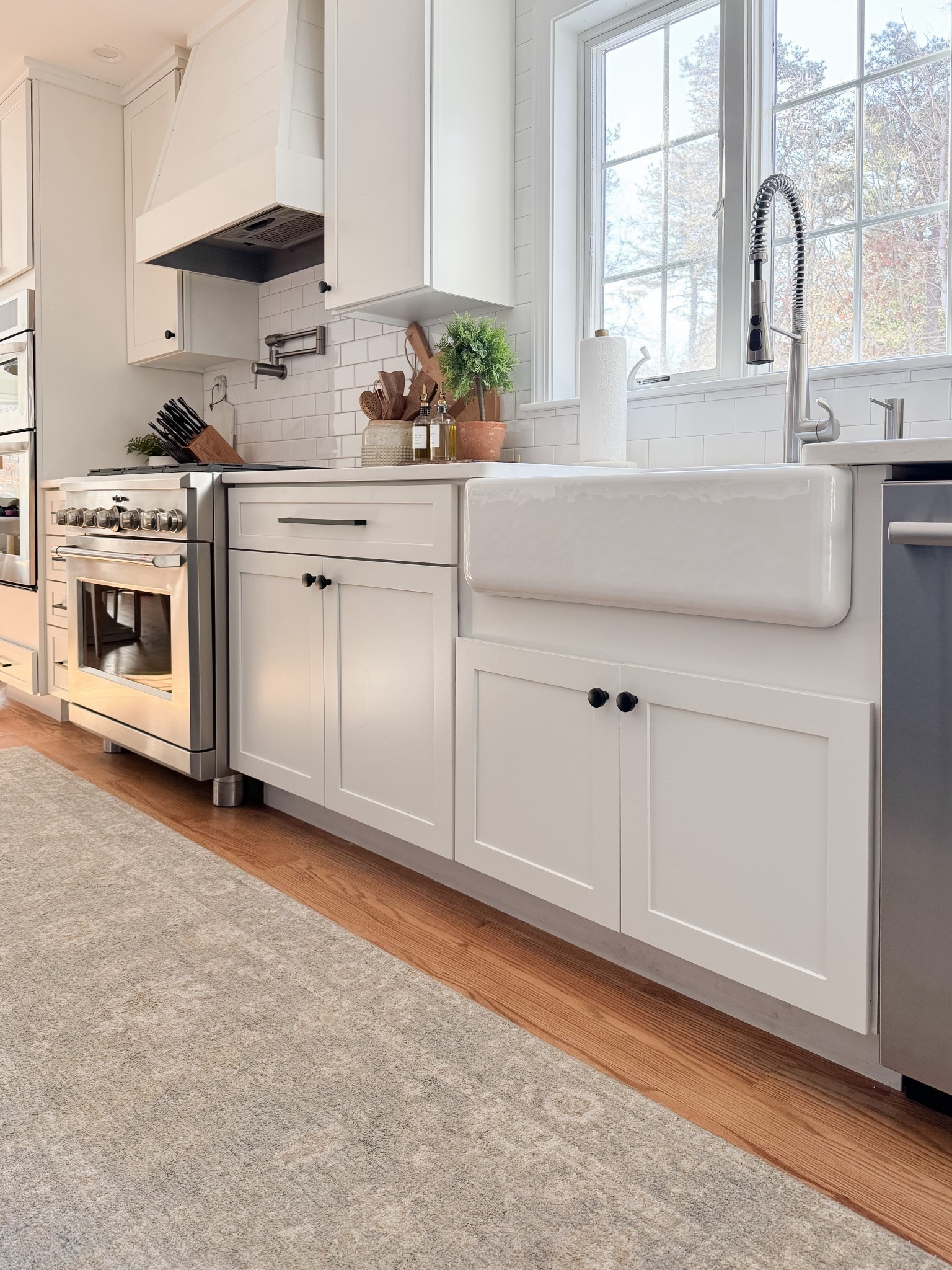 Simple countertop styling with wood accents and glass bottles creates an elevated everyday kitchen moment. coastal kitchen decor, kitchen styling ideas, oil and vinegar bottles, neutral home decor, designer inspired kitchen, coastal interiors, natural textures, kitchen inspiration, sherricalnanhome

#LTKHome