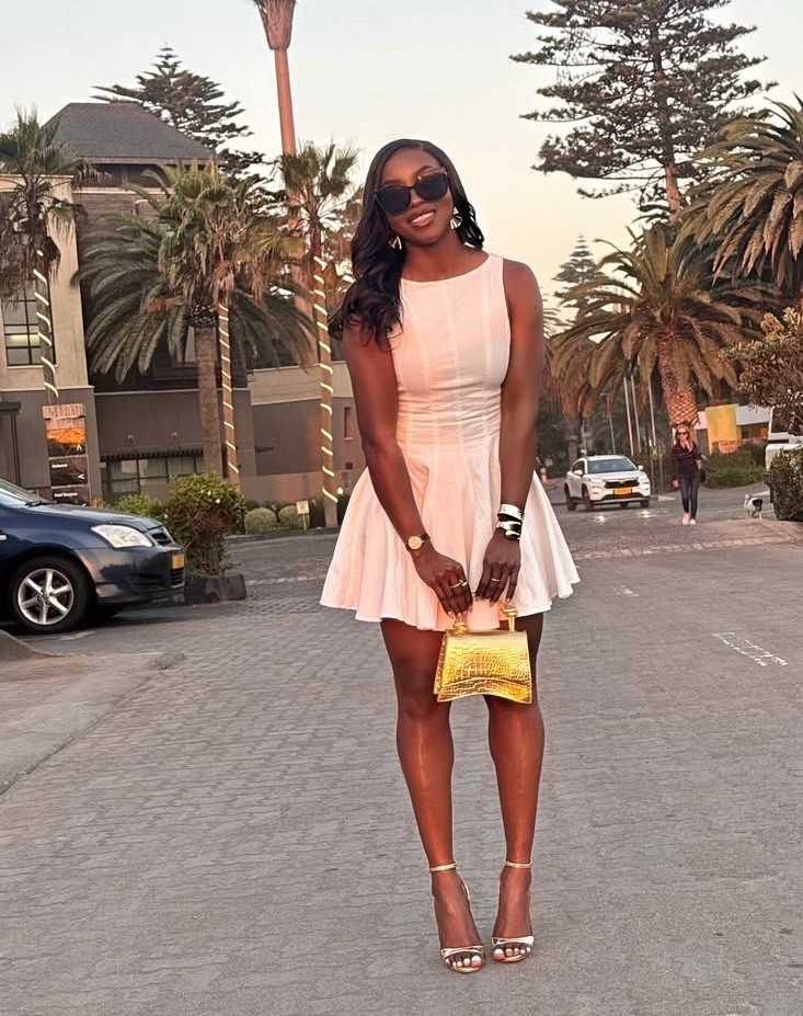 White A line dress 
Gold top handle bag 
Gold heel sandal

#LTKShoeCrush #LTKItBag #LTKParties