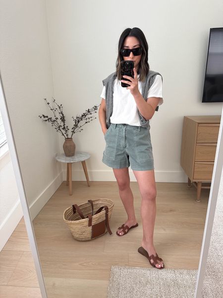 Gap Carpenter shorts. These are great. Like some of the best I have in this style. I sized up. Green color is a little more blue than I like but comes in multiple colors. On sale! 

Everlane tee medium
Gap shorts 2
Hermes Oran sandals 35
Loewe tote medium
J.crew sweater xs
Celine sunglasses  

Spring outfits, summer outfits, shorts, sandals, petite style 

#LTKfindsunder50 #LTKshoecrush #LTKsalealert