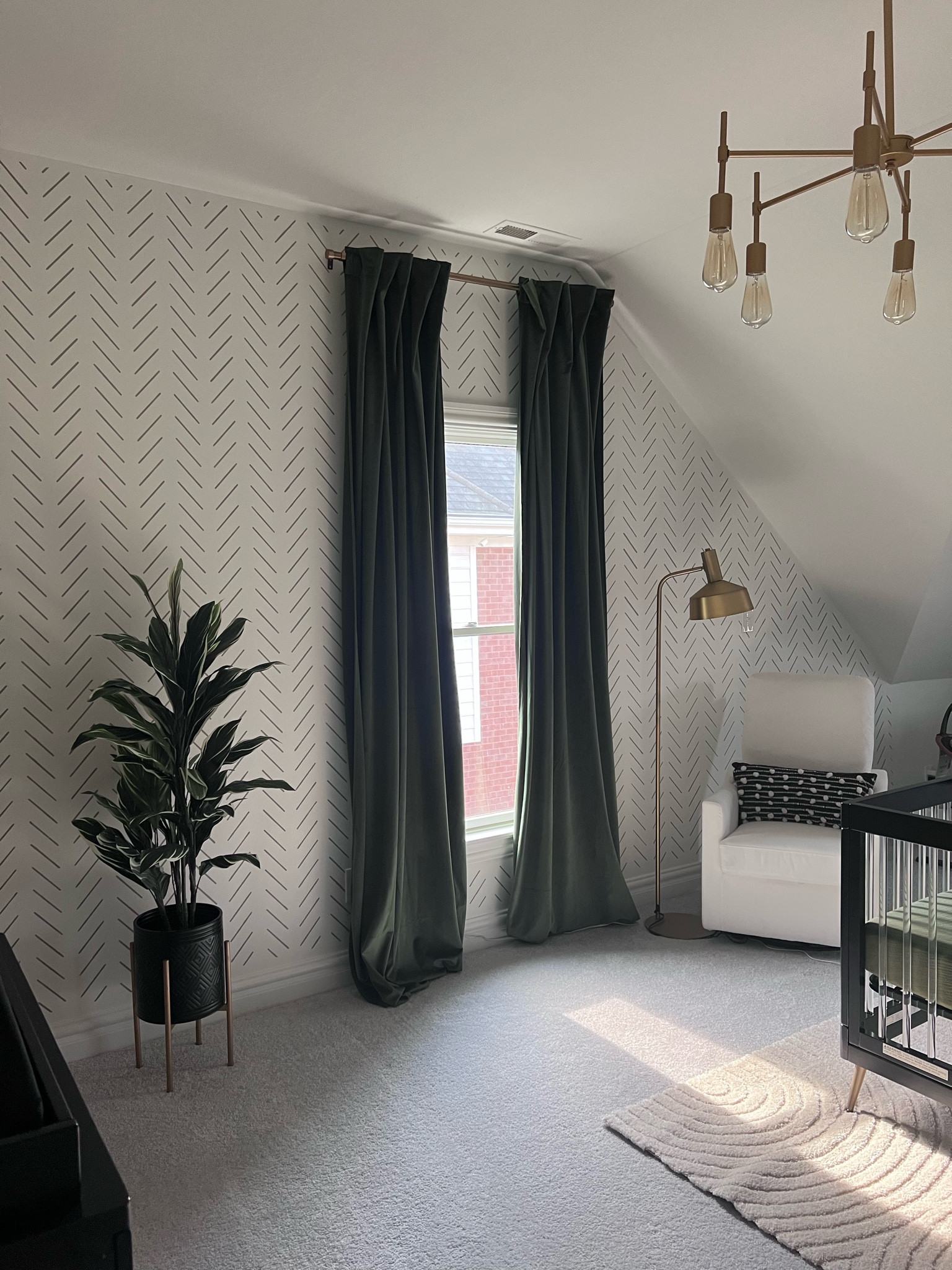 Nursery sitting area and glider chair. Modern neutral nursery in gold, cream, black and green  

#LTKbump #LTKbaby #LTKfamily