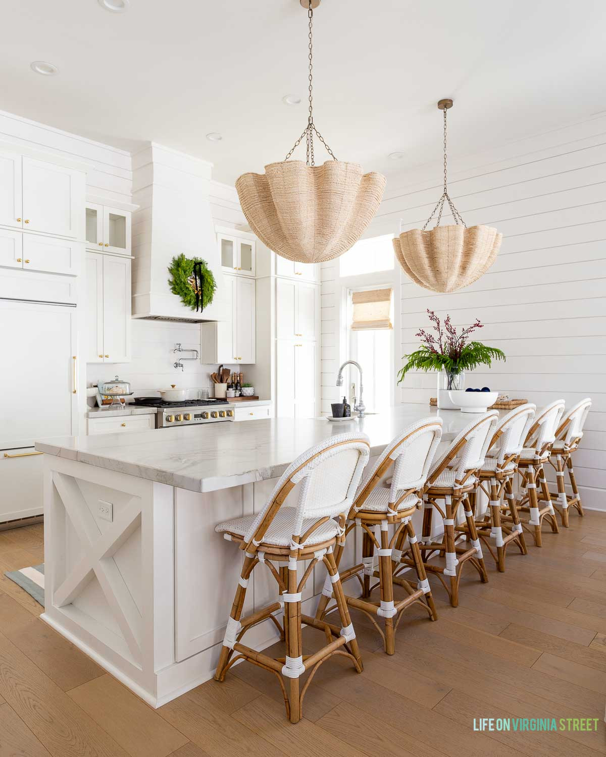 Holiday coastal modern kitchen // Christmas kitchen decor // wreath , chandelier // counter stools  

 #LTKHoliday #LTKSeasonal #LTKHome
