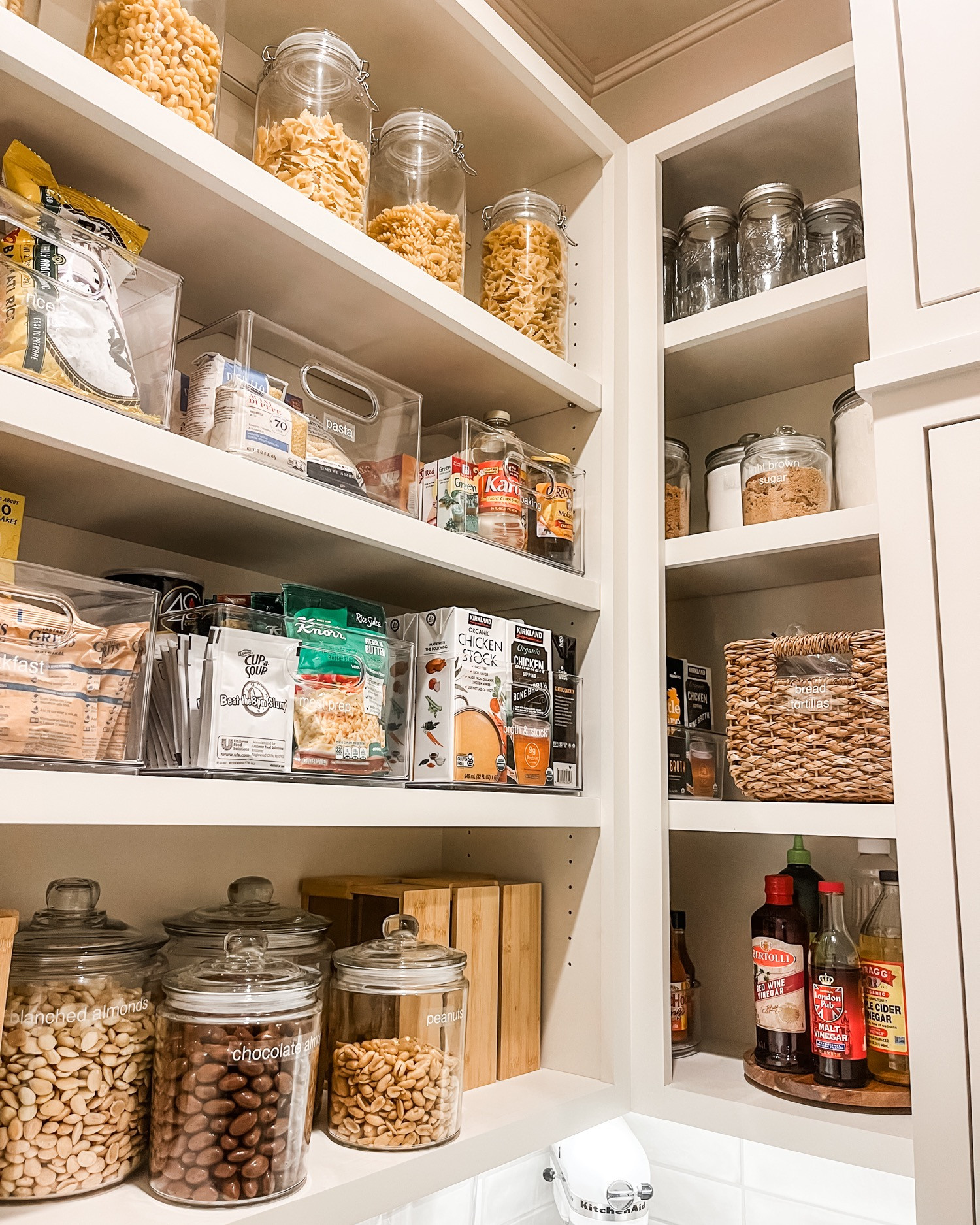Give us a packed pantry but make it organized! Clear bins, lazy susans, canisters, and baskets mean there are zones and a method to the madness going on! Pantries have stuff and get full pretty quickly - that's just life!
 

 
