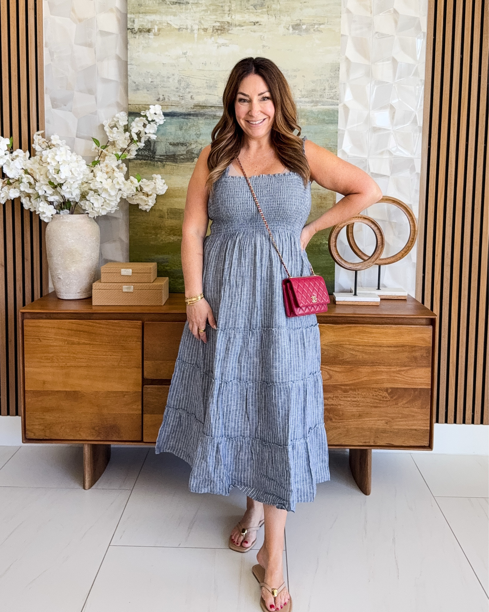 This striped smocked midi is the effortless summer dress I've been reaching for on repeat * 🌿

Dress: TTS, L 

 #midisummerdress #summeroutfit #stripes