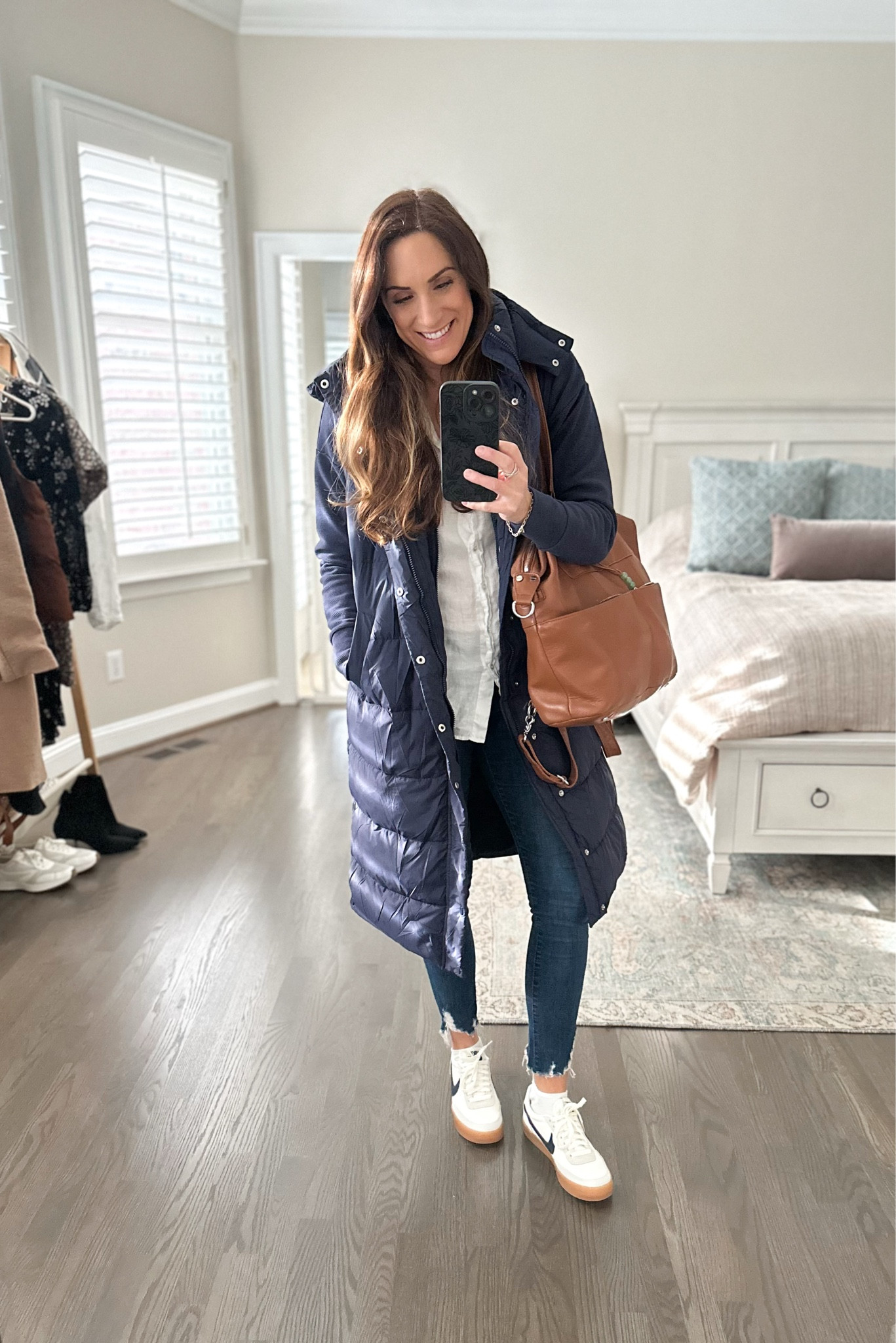 Winter layering made simple! This cozy long puffer vest is perfect for running errands or chasing after little ones. Paired it with these classic Nike sneakers and this versatile bag that works as a diaper bag, work tote, or everyday carry-all. All the details are linked for you to shop below! 🖤

#LTKSeasonal #LTKOver40 #LTKFindsUnder100