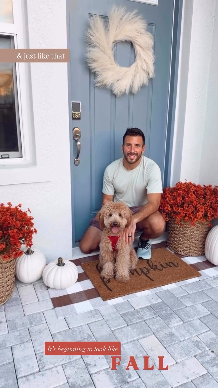 Fall Porch + Fall Patio Decor - Artificial Mums styled in a woven basket with artificial white pumpkins, a plaid mat, seasonal fall welcome mat, + a cream pampas wreath for the front door. The fake pumpkins come as orange pumpkins in various sizes too. The artificial mums also come in a variety of fall colors. This only took me a few minutes to put together and decorate our front porch/ patio. I arranged the mums into the styrofoam and then placed each set in a basket. This is an easy + cozy way to decorate your home for fall!

#LTKHome #LTKSeasonal #LTKSaleAlert