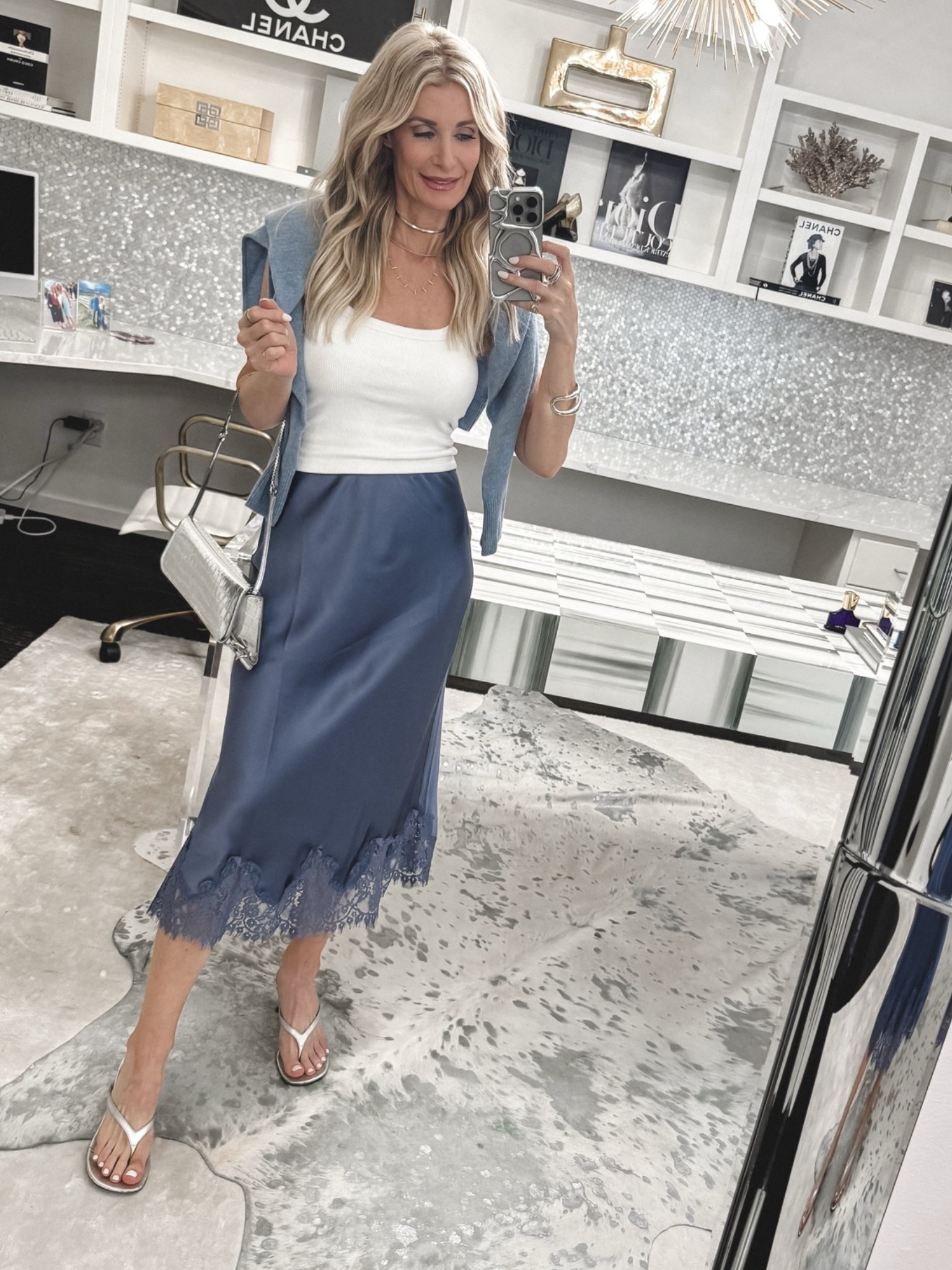 Blue is having a major moment 💙 This blue satin midi skirt with lace trim feels feminine, polished, and perfect for a spring brunch outfit or lunch with girlfriends.

Styled with a white tank, baby blue cashmere sweater, and silver kitten heels. Wearing an XS in the skirt and top. #LTKStyleTip 

 

#LTKOver40 #LTKSeasonal