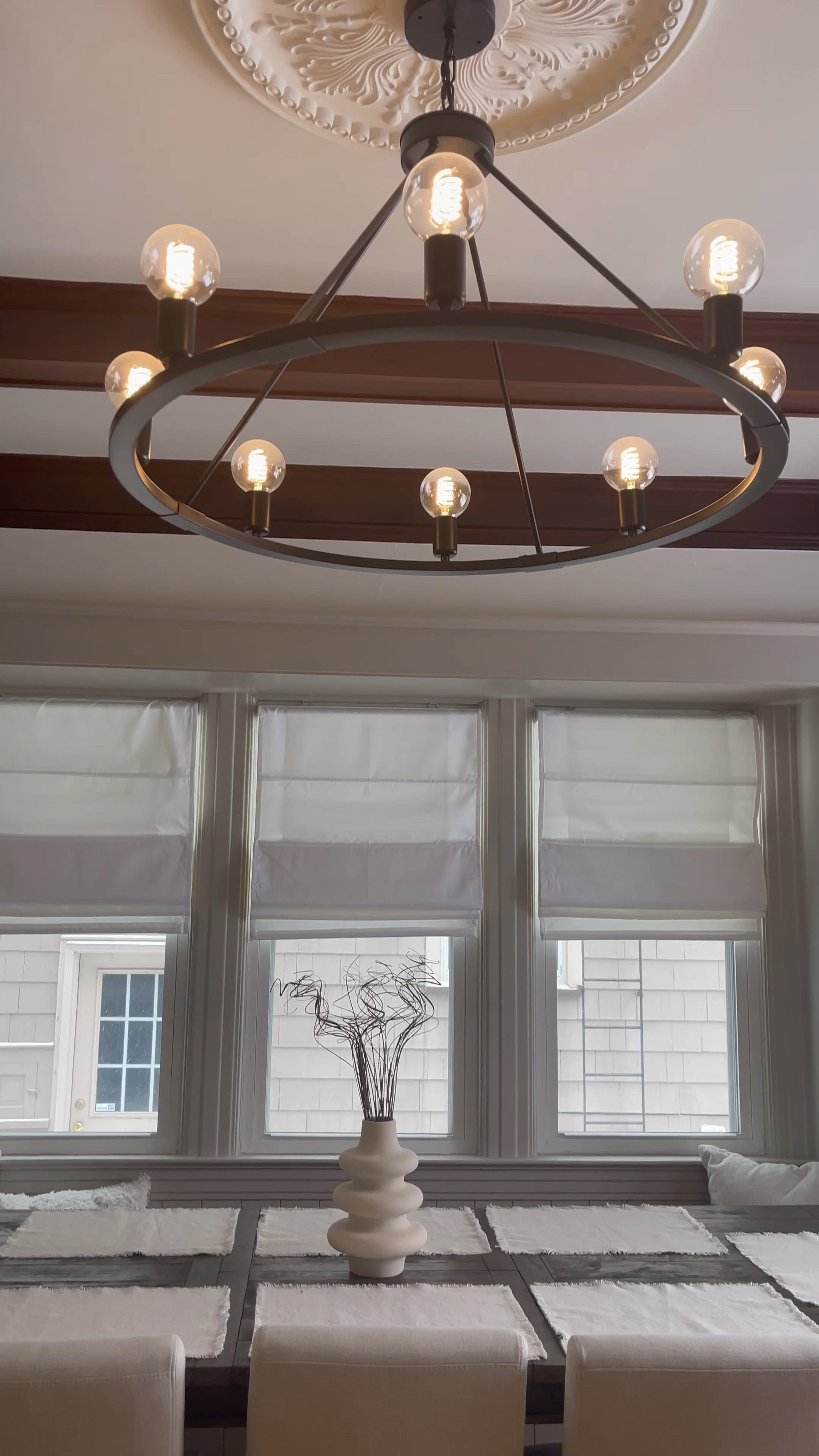 Dining room decor - mix of modern and traditional, statement chandelier, Victorian home, window bench, neutral, white walls, Target chairs, farmhouse modern table

#LTKhome