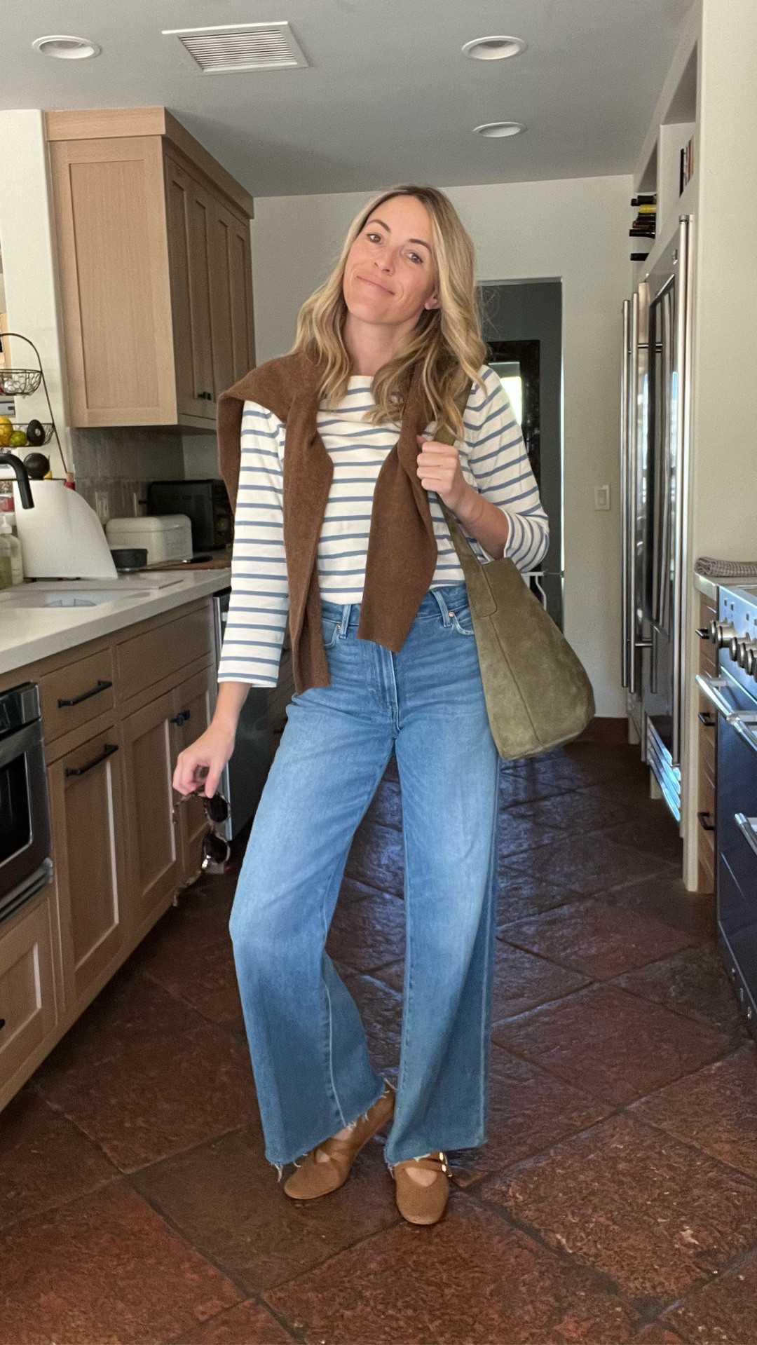 Outfit of the day 🩵🤎

Sizing:
Top runs tts. Laura in a small here. Jeans also run tts. Laura in a 26 and the 31” inseam. She is 5’5."

#LTKStyleTip #LTKSeasonal #LTKOver40