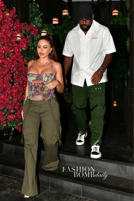 Newly engaged couple @larsapippen and @heirmj523 grabbed dinner @catch , with #larsapippen in cargo pants and a $440 @robertaeiner multicolored bustier top. Would you splurge?
Find a link to purchase in our bio!
📸 Backgrid #larsapippenfbd #marcusjordan 

#LTKcurves #LTKover40
