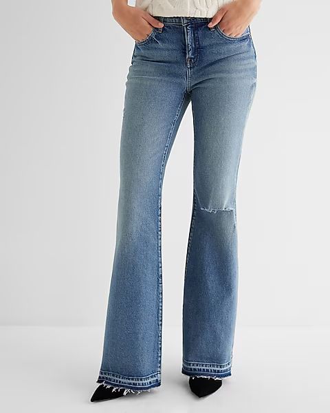 Mid Rise Medium Wash Raw Drop Hem '70s Flare Jeans | Express