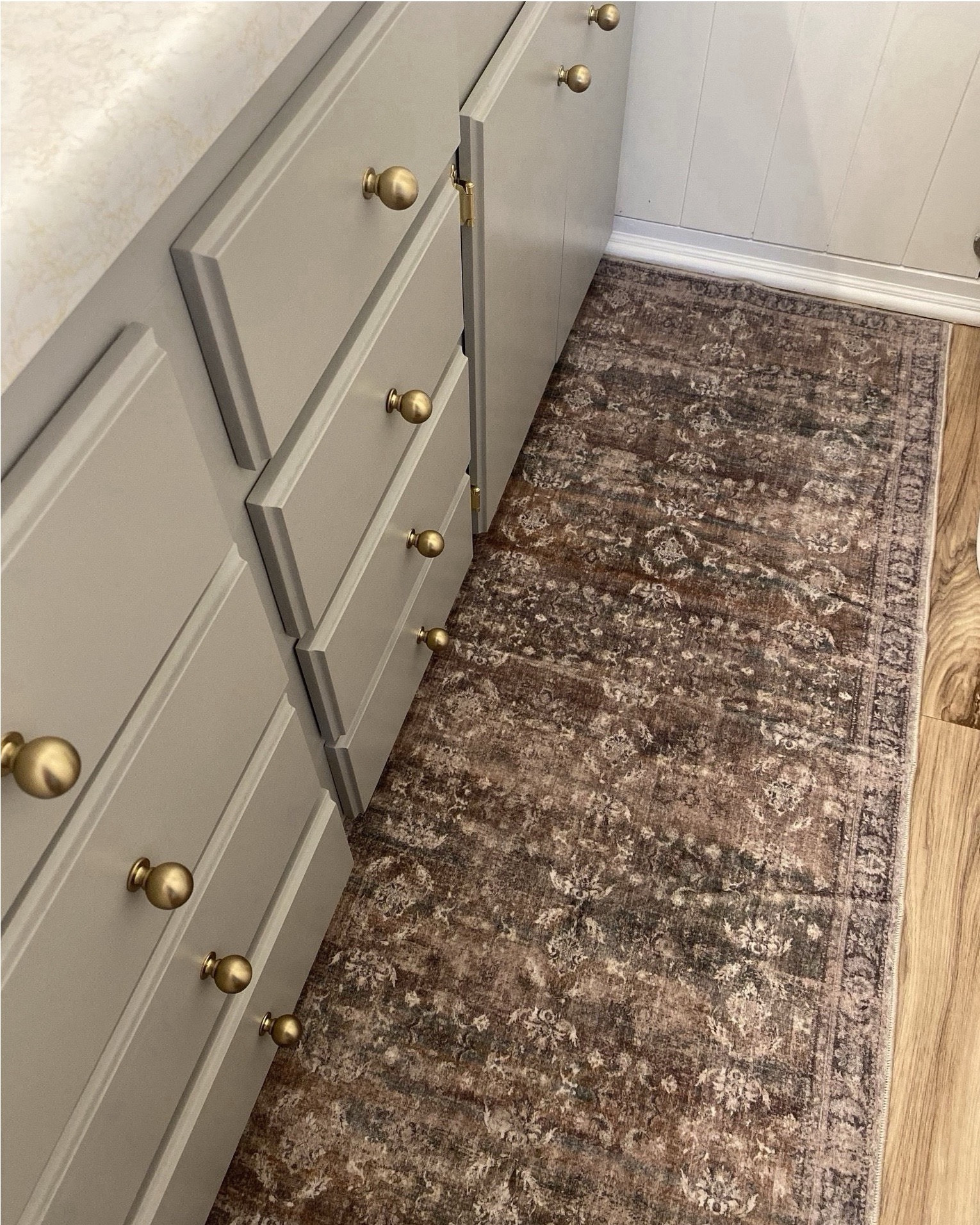 Bathroom styling idea ✨ Bathroom refresh, vintage rug, gold knobs, round mirror, gold faucet, towel hook, hand towel, soap dispenser, marble tray, gray cabinets, gray bathroom vanity, amazon favorites 

#LTKSaleAlert #LTKHome #LTKStyleTip