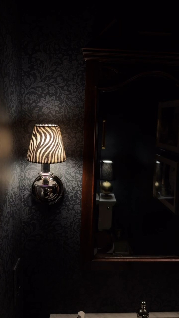 #AD I love the way the zebra print of these lampshades plays off of the black and white photos and floor tile in the powder bath. Linked them and a bunch of other elevated animal print finds from @wayfair, #Wayfair, #WayfairPartner 

 #LTKHome
