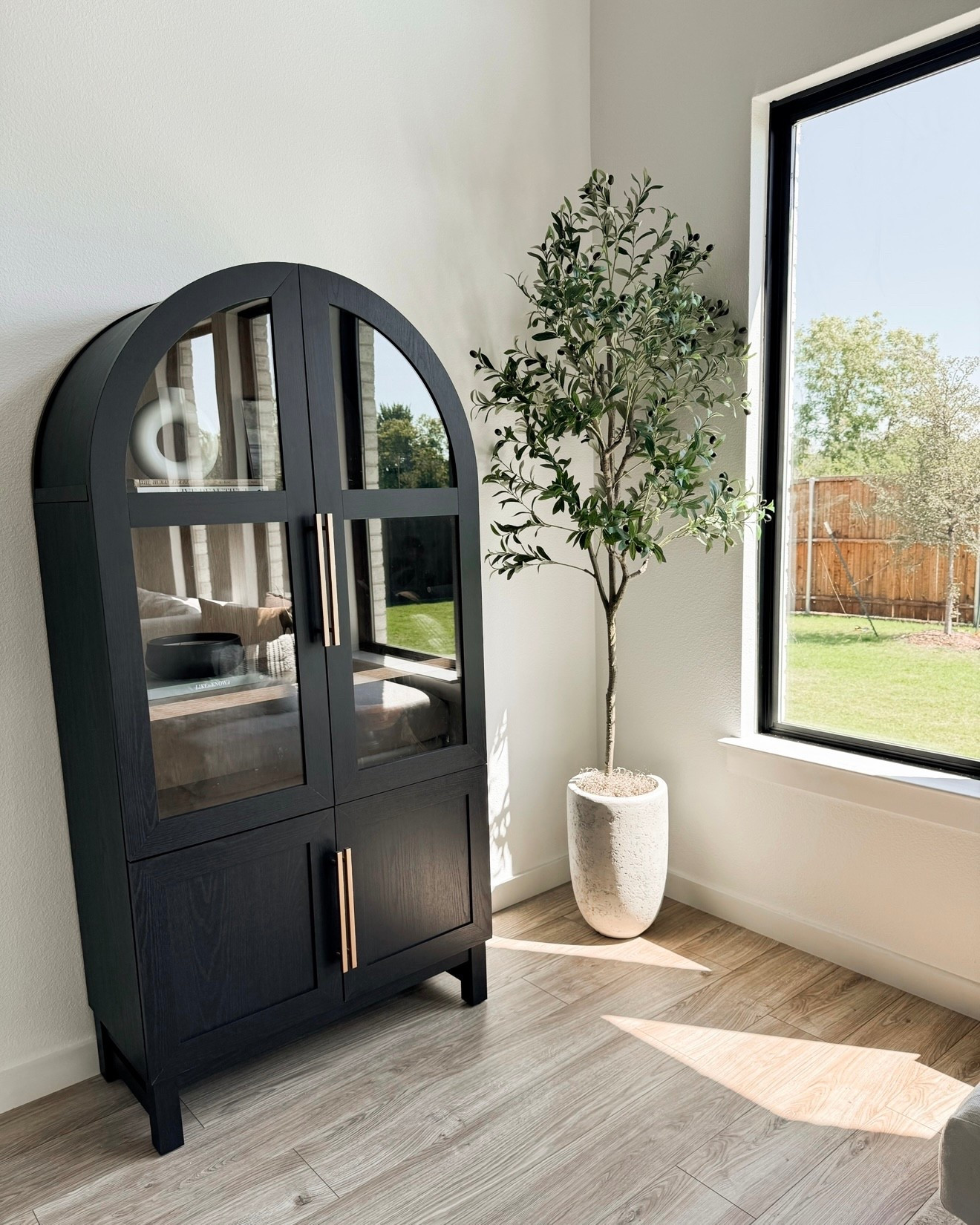 Arched cabinet and 7ft olive trees

Organic modern living room, neutral home decor, English modern, transitional modern 